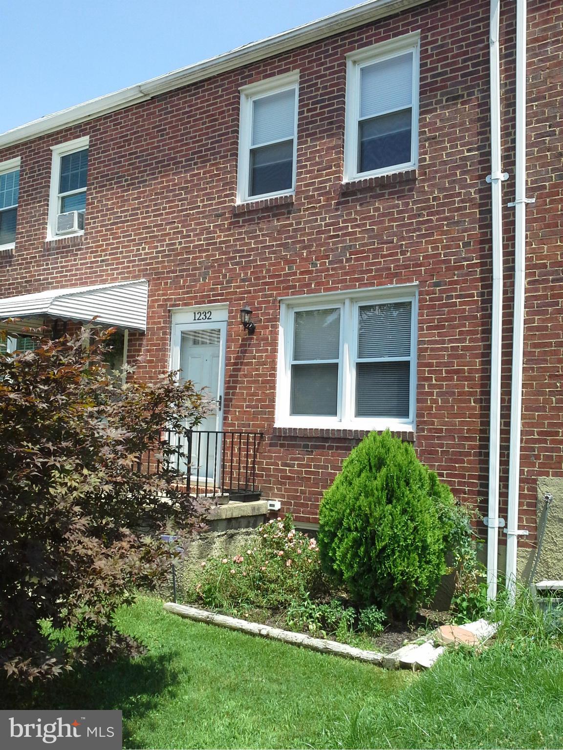 Stop paying rent. This solidly built brick THS is the perfect starter home. Located on a quiet one way street and facing open space gives you extra parking and the feeling of peace and nature.  Kitchen has been updated with lots of cabinets. The hardwood floors are richly finished and the room sizes are generous. Cozy clbrm or BR on lower level with half bath. Brand new high efficiency  furnace.