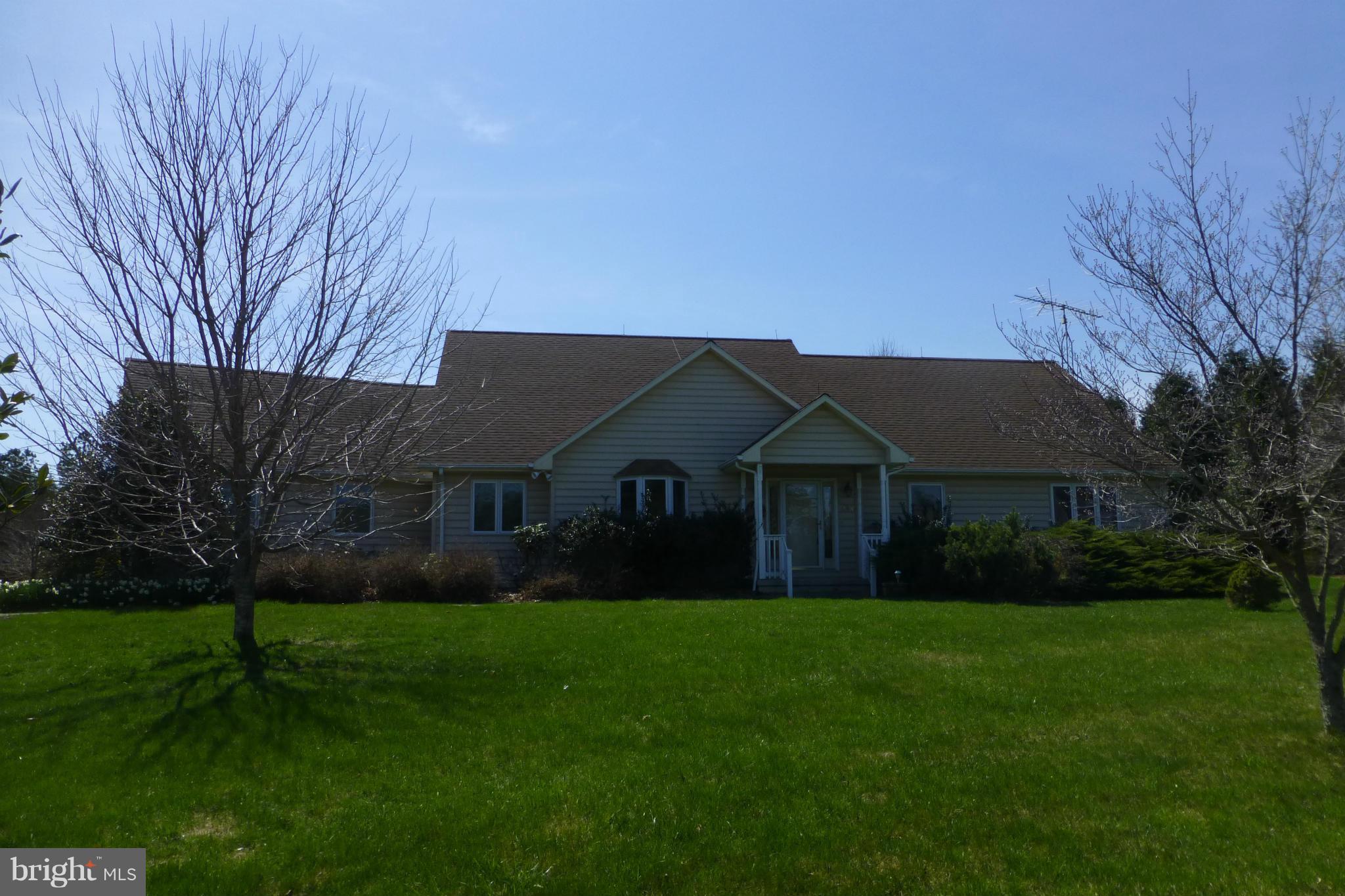Solar powered home means low utility bills! Main floor master bedroom suite, spacious living/dining/kitchen area with hardwood floors and gas fireplace. Finished basement with office. Large screened porch overlooks private, well landscaped yard with a beautiful fish pond and waterfall. Two car attached garage. Close to the Cacapon State Park for fishing, golf, hiking, swimming, dining.