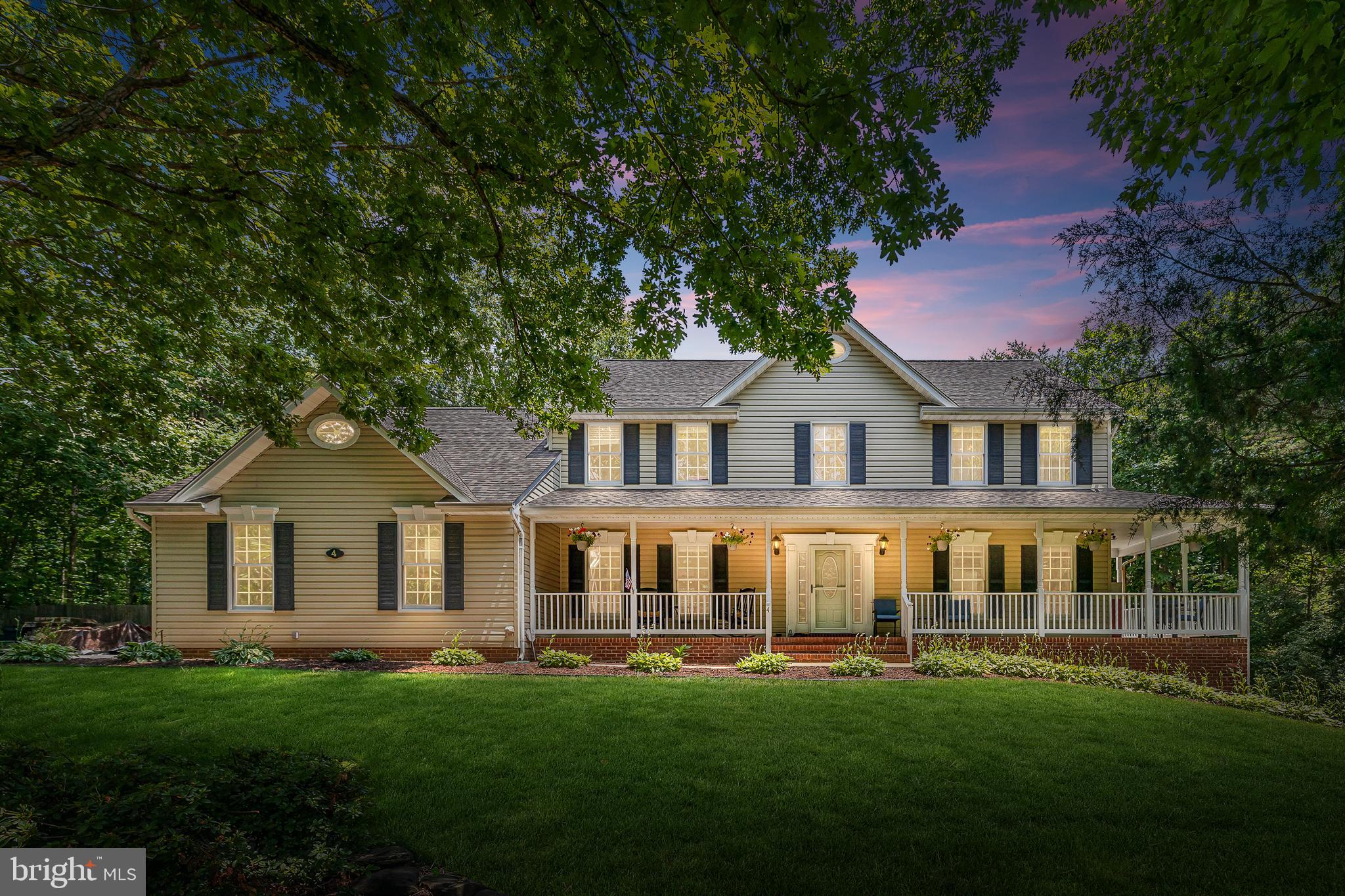 Over 4200 square feet in this gorgeous colonial with front wrap around porch minutes from I-95 in Stafford has too many features to list! 4 spacious bedrooms and 4 full baths. A kitchen for a cook with top of the line range hood, double ovens, grill and gas griddle, island with vegetable sink, dream walk in pantry. Formal living and dining rooms with hard wood flooring and moldings, family room with built-ins and fireplace, sprawling master suite, and main level bedroom. Walk-out basement with wet bar, large rec room, and three additional rooms. Deck overlooks the gorgeous yard with park like setting and privacy fence. Several recent improvements. LOCATION is incredible 1 acre close to I-95, restaurants, shopping and commuting! MAKE YOUR APPOINTMENT TODAY!