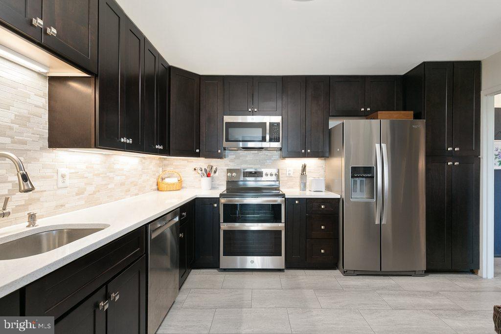 ****MOTIVATED SELLER --- $15,000 PRICE IMPROVEMENT & SELLER IS OFFERING BUYER CREDIT TO COVER THE FIRST 3 MONTHS OF CONDO FEES IF CONTRACT SIGNED BY OR BEFORE  6/15/2026 Condo Fees Include All Utilities***
-------------------------------------------------------------------------------------------------------------------------------------------
STUNNING & COMPLETELY UPDATED CONDO - IN UNIT WASHER & DRYER -  double balcony and fabulous western Sunset and tree top views!!!  This spacious 2BR/2BA condo is located on the 15th floor of Bethesda's popular Westlake Towers, and features a double balcony with access from both the dining room and living room. Residents will enjoy incredible tree-top views and stunning western sunsets.    The unit has 1,246 square feet of open inviting space ideal for entertaining and modern living.  The spacious gourmet kitchen features beautiful espresso-colored, ceiling-height cabinets, quartz counters, new stainless steel appliances, tile backsplash, and under-counter lighting, and added counter space peninsula that separates the kitchen and dining room and with tons of natural light and balcony access.  The open, spacious, living/dinning rooms fill with natural light from the double balcony sliders with remote shades, and boast clean, beautiful luxury vinyl plank flooring which carries into the foyer, hall, and 2 generously-sized bedrooms with plantation shutters; the 2nd bedroom across from the updated hall bath with tub shower, and the primary bedroom suite with walkin closet, and updated full primary bath.  Laundry in unit and abundant closet space; including large coat closet with California Closet insert.  Seller even paid $12K to have popcorn ceilings professionally removed and smoothed out, freshly painted, and MOVE-IN READY!!!   Live a stress-free lifestyle where ALL UTILITIES ARE INCLUDED in the condo fee in addition to cable tv, lawn care, snow removal, trash, and structural maintenance. Easy access to I-270 and I-495. Westlake Towers has amenities galore - fitness room, outdoor swimming pool, tennis, club room, etc. Unassigned and abundant parking. Proximity to the mall, minutes from downtown Bethesda, Park Potomac, Pike & Rose, and Cabin John Park.  Mortgage savings may be available for buyers of this listing.