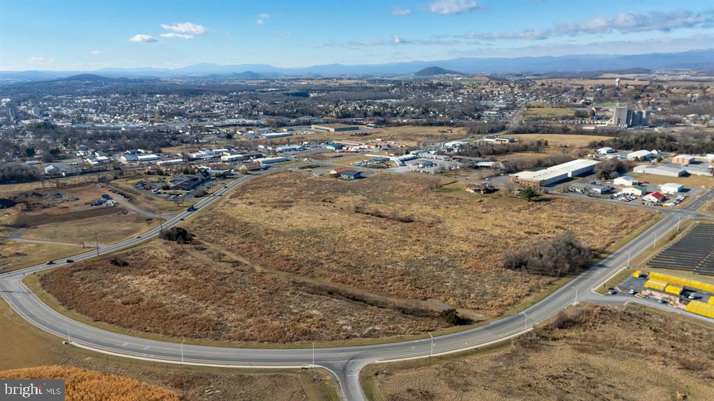 25.8 acre parcel that can be divided to a user's needs. Additional acreage also available, see MLS# for parcel fronting on Mt Clinton Pike. Thesubject parcel sits at road grade with access to a 8" water line and 8" sewer line through the property reducing overall development costs, as well as, having access toNatural Gas! Located between two major corridors and less than 3 miles to I-81 -- the site offers convenient access. Divisible lot sizes available to meet user'sspecifications within one of Harrisonburg- Rockingham's most established industrial areas. See also MLS #672402 For Information On Adjoining Parcel.