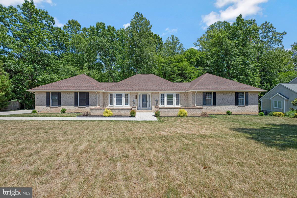 Welcome to Kings Grant, one of La Plata's most established and sought-after neighborhoods. This beautifully maintained brick rambler offers the convenience of main-level living, generous room sizes, and incredible potential for future expansion. From the moment you arrive, you'll appreciate the impressive curb appeal. A custom paver driveway, manicured landscaping, colorful flower beds, and a welcoming walkway create a picture-perfect first impression. Since purchasing the home, the owners have continued to invest in and enhance the outdoor spaces, creating an inviting setting to enjoy year-round. Inside, you'll find a bright, open floor plan featuring luxury vinyl plank flooring throughout the main living areas, updated carpeting in the bedrooms, fresh paint, and stylish lighting. The spacious kitchen has been thoughtfully updated with granite countertops, stainless steel appliances, abundant cabinetry, and a sunny breakfast area perfect for everyday living. The family room is anchored by a cozy fireplace, while a dedicated home office provides the flexibility today's buyers are looking for. The private primary suite features dual closets and an ensuite bath complete with a jacuzzi tub and separate shower. Outdoor living is just as impressive, with a large deck and expansive patio offering plenty of space for entertaining, grilling, or simply relaxing while enjoying the beautifully maintained yard. Need more space? The enormous unfinished basement offers over 2,100 square feet of future potential and already includes a rough-in for a third bathroom. Whether you envision a recreation room, home gym, media room, additional bedrooms, or multigenerational living space, the possibilities are endless. Convenient Access to Shopping, Dining, Schools, and Commuter Routes Offering the perfect combination of comfort, functionality, and future potential, this move-in ready La Plata home is ready for its next chapter.