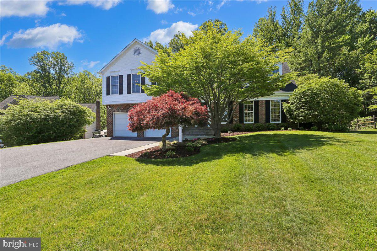 Major Price Adjustment! This is the kind of home buyers hope to find...! Beautifully cared for, full of charm, and ready for its next chapter. Come see it in person, and you'll understand why it stands apart from the competition.

Tucked away on a quiet cul-de-sac surrounded by mature trees and thoughtfully curated landscaping, this beautifully updated home blends timeless charm with elevated modern comfort. From the moment you arrive, you’ll appreciate the impressive curb appeal featuring updated front landscaping, a welcoming walkway and steps, expanded driveway, and additional gravel parking pad, all contributing to the home’s warm and polished presence.

Inside, sun-filled living spaces and a flowing layout create an atmosphere that feels both elegant and comfortable. Warm hardwood floors, spacious gathering areas, and thoughtful design touches throughout make the home equally suited for everyday living and entertaining. The beautifully remodeled kitchen serves as the heart of the home, offering rich cabinetry, granite countertops, stainless steel appliances, expansive island seating, and a cozy breakfast area overlooking the peaceful backyard. Nearby, the family room is anchored by a stunning high-end Mendota gas fireplace insert, creating the perfect setting for quiet evenings or gathering with family and friends.

All three bathrooms have been tastefully renovated with premium Porcelanosa Spanish tile and refined finishes throughout. The luxurious primary bath feels like a private retreat, showcasing a freestanding soaking tub, oversized glass shower, and spa-inspired details that bring a sense of relaxation and sophistication to everyday life.

Outdoor living is equally impressive. The expansive rear deck and beautifully appointed gazebo create an ideal extension of the home — perfect for summer dinners, morning coffee, or simply unwinding while enjoying the private tree-lined backyard setting. Every improvement has been made with care, creating a home that feels effortlessly maintained, thoughtfully upgraded, and truly special.

Additional items conveying with the sale include three deck sofas and a coffee table, a garage safe, a garage refrigerator, and a Weber grill (Hooked up to the natural gas line). TVs convey with the exception of the basement television. A rare opportunity to own a meticulously maintained home offering timeless style, meaningful updates, and a setting that feels both peaceful and inviting.