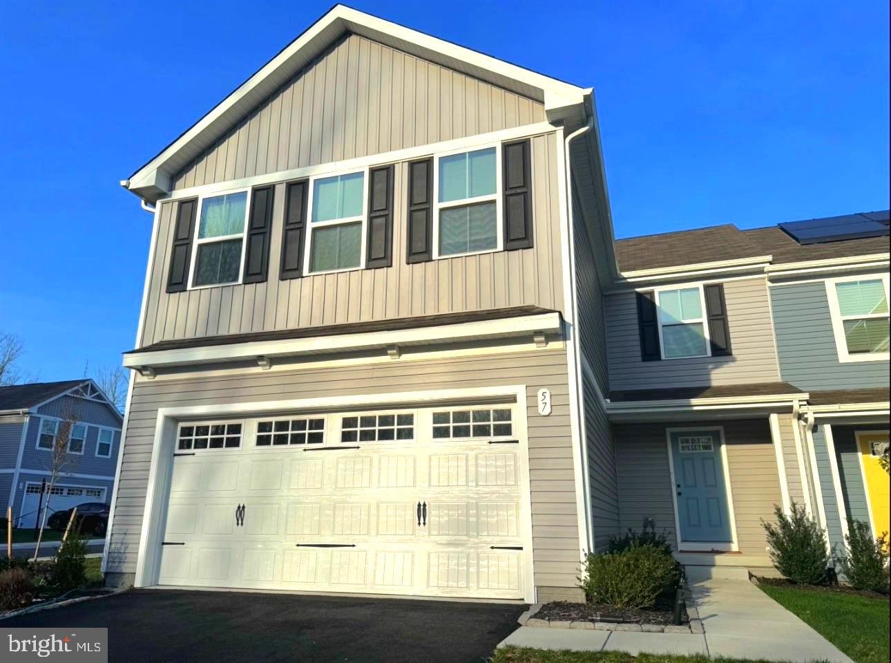 Welcome to 57 Teatree lane, a beautiful twin family home nestled in the heart of Elkton, MD.  This property is an end unit with lots of yard space. Just built in 2023, this Ivy model home is like buying new construction. This spacious residence offers 4 bedrooms and 2.5 bathrooms, providing a comfortable living space. The open floor plan welcomes you into a large living room & dining room combo, which than flows into the large eat-in kitchen area.  A beautiful island lends a casual place to prepare your meals, eat or entertain. All kitchen appliances are stainless steel. Upstairs, the generous living space continues with a broad stairway that leads to an open landing. The bedrooms are oversized and elegant and all feature ample closet space. The oversized upper level laundry room includes a washer and dryer. There is a 2-car garage and a full, unfinished basement ready for you to design when you are ready to expand!! You are minutes away from boating, hiking, golfing, casinos, water parks and world class hospitals. Or simply stay at home and enjoy the wide array of community amenities including a clubhouse, pool, splash pad, playgrounds, athletic field, picnic pavilion, and dog parks. All that is missing is YOU!  Make your appointment today!