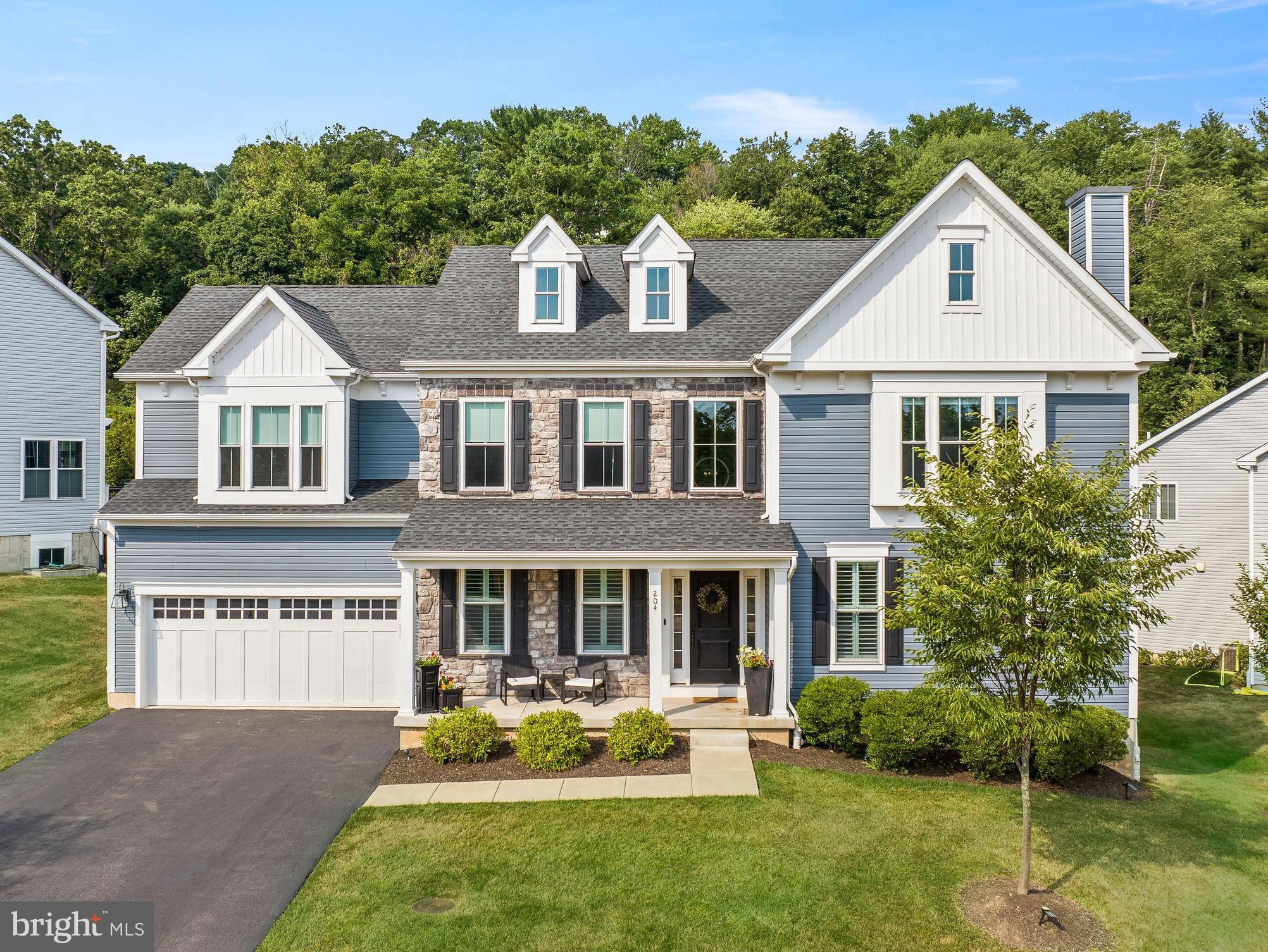 Looking for a new home? Welcome to 204 S Landmark Lane, a 5 year young, exquisitely built, new home with impeccable views across from the original farmstead within Piszek Preserve. Step through the 2-story center hall into versatile spaces, including an office/flex room currently used as a playroom, and a family room featuring a stacked stone gas fireplace framed by large windows adorned with plantation shutters, bathing the room in natural light. The eat-in kitchen boasts stainless steel appliances, a farmhouse sink, wine fridge, and a large marble island with a built-in microwave and bar seating, perfect for casual dining or entertaining. The dining area offers sliding glass doors leading to an elevated wood deck. A convenient half bath and access to the 2-car garage complete this level. Ascend to the second floor where the expansive primary suite awaits, offering a charming window seat, two walk-in closets and an ensuite bathroom with dual vanities, water closet, and a luxurious walk-in rainfall shower. Three additional bedrooms, a hall bath with double vanity, and a conveniently located laundry room ensure comfort and functionality for the entire household. The basement is an entertainer's paradise, featuring a fully finished secondary living space with an additional half bath and a built-in wet bar, perfect for hosting gatherings. Situated on a picturesque 0.22-acre lot backing to a wall of mature trees, privacy and tranquility abound. Enjoy the serene surroundings of Piszek Preserve while being just minutes away from the Oreland Septa Station, major highways including 309 and 276, all offering effortless commutes to Philadelphia and New York. All this and award winning Upper Dublin School District . Don't miss the opportunity to make this stunning property your new home. Schedule your showing today and experience the perfect blend of comfort, style, and convenience at 204 S Landmark Lane.