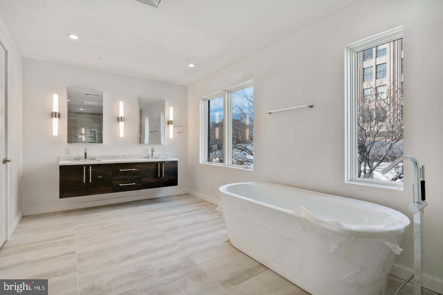 24 Foot wide new construction home Located on Van pelt street, House #8 has 2-Car Parking, Roof Deck, Elevator, Pending Tax abatement and amazing floor plan all within the Greenfield School Catchment in the Logan Square area of Center city Philadelphia. Top of the line design and construction by the city's premier architect and developer. The designer kitchen has top of the line sub-zero and Wolf alliances, amazing stone counter tops and a huge deck for entertaining. In addition to the huge roofdeck there is also a very large deck off of the living room perfect for entertaining.Tall ceiling heights, smart home system, phenomenal views and more. Enter your new home through the 2 Car Garage with Private Driveway. 4 Bedrooms plus media room, additional office and additional play room.. 4 full Baths and 2 half baths. Finished Basement . Energy Efficient Dual HVAC Systems. Security Alarm with 2 Keypads. Video Intercom System & Home automation system. 8' Solid Core Interior Doors. Metal Handrails/Railings on Stairs. Wood Stairs with stained risers and treads.Tax Abatement Pending. Take advantage of this once in a lifetime opportunity while it still lasts. These homes are selling quickly... Come visit our showroom to view selections! delivery date 2/228/2018. walk to the Comcast center, Rittenhouse, Fairmount Park, Riverwalk and more. Still time to customize and pick finishes. The home is framed, walk the floor plan! Check OPA for 2019 taxes due to possible citywide reassessment.