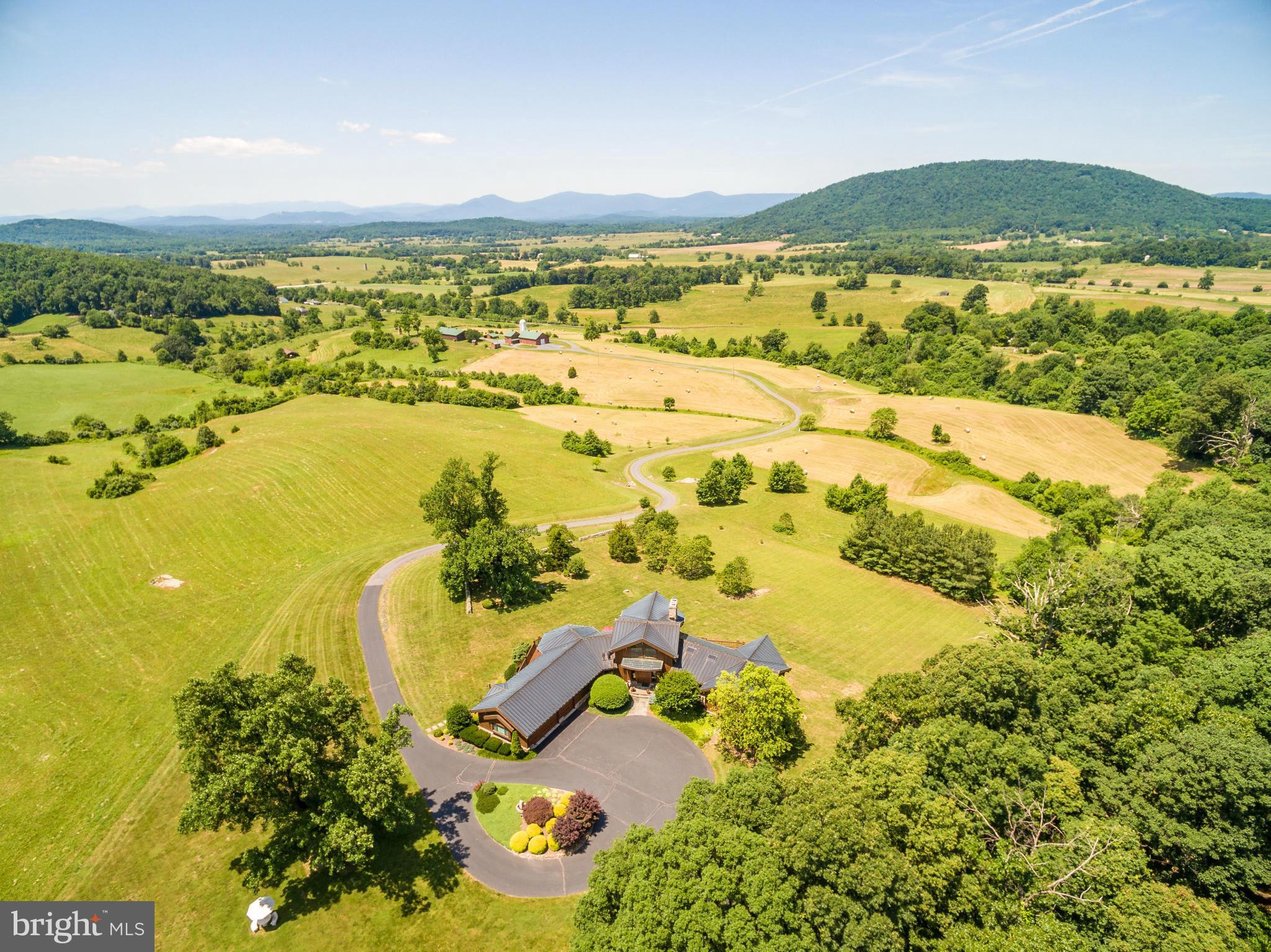 See links to Interior 3-D Virtual & Exterior Drone Tours!  Magnificently-sited on what may be the most beautiful view in Fauquier County, this 7,000 sq.ft. uniquely-crafted post & beam residence. 118 acres, w/add'l 50'x90' and 40'x60' secure buildings & 1,200 sq.ft. tenant apt/farm ofc. Suited for vineyard, agriculture, classic car enthusiasts, or luxury retreat  .