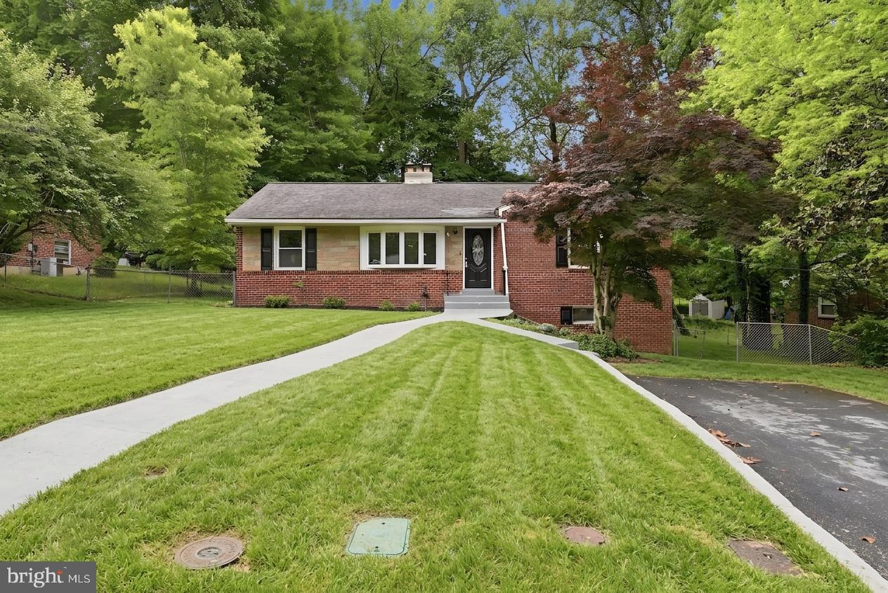 Welcome to 4915 Sharon Road in Temple Hills, MD. Built in 1957, this well-maintained home offers the perfect blend of classic charm and functional living space. The main level features beautifully refurbished hardwood floors, neutral paint tones, three bedrooms, and a full bath. As you enter the home, you are welcomed into a bright living room with a fireplace that flows into the dining area and kitchen, creating a comfortable layout for everyday living. The kitchen also provides direct access to the rear deck, making it easy to enjoy outdoor gatherings or quiet evenings at home.

The lower level expands the living space with an additional living area featuring a second fireplace, a full bath, two additional bedrooms, an office, laundry area, and ample storage space. While the tax record may reflect approximately 2,424 square feet, this home delivers the space and flexibility today’s buyers are looking for.

Conveniently located for commuters, this property offers quick and easy access to I-95, making travel to Washington, D.C., Northern Virginia, and surrounding areas a commuter’s dream.  A few of the pictures have been digitally enhanced for lawn cutting and staged