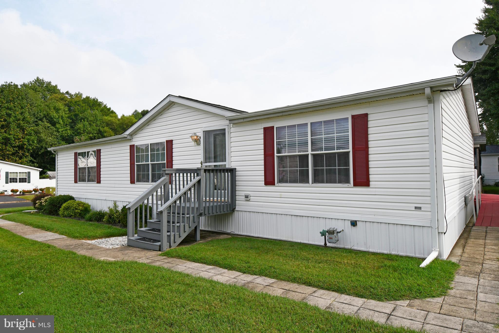 55+ Community - The Village of Cecil Woods. The Susquehanna Model -  New HVAC and Water Heater. Very generous sized rooms Large kitchen with island, master bedroom with attached bath. Walk in closets. Meticulously maintained. Community clubhouse, Exercise room, Game Room, Library and Kitchen - close to Rt 40 & Rt I-95. Buyer must obtain Park Approval. Monthly Ground Rent $512. Additionally this house has more insulation than most houses - 6-inch outside walls have R19 insulation, floor has R22, and ceiling has R32.  A/C unit is also a heat pump that will heat the house when outside is above about 38 degrees and is cheaper than using the furnace. Furnace is only used when colder or 'emergency heat' is selected on thermostat.