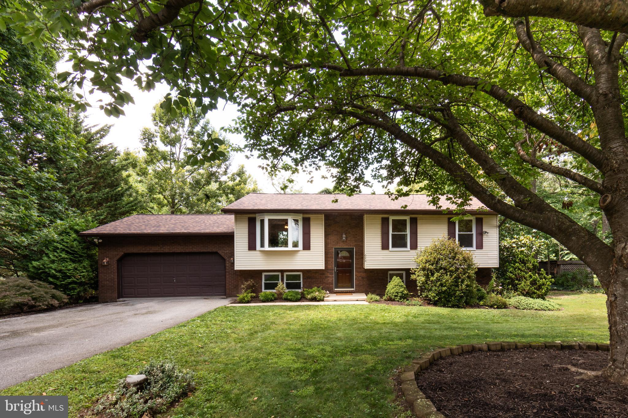 If you've been searching for a home where the work has already been done, 626 Barnes Avenue deserves a look. Thoughtfully renovated and meticulously maintained, this home is truly move-in ready, with fresh paint throughout, brand-new luxury vinyl plank flooring across the main level, new high-quality carpet in the basement family room, and a beautifully renovated primary bathroom. Just as impressive are the behind-the-scenes updates that give the next owner real peace of mind: a new CertainTeed roof with a lifetime warranty installed in 2025, a new HVAC system installed in March 2024 with a 10-year parts warranty, a new water heater in 2023, a new dishwasher in 2025, a brand-new stove that has never been used, and more. Inside, the spacious living room flows naturally into the dining area and kitchen, creating an easy layout for both everyday living and entertaining. The kitchen offers sleek white cabinetry, elegant Corian countertops, and updated stainless steel appliances, while a sliding door from the dining area leads to a large deck overlooking the fully fenced backyard. The flat lot, spanning more than half an acre, provides plenty of room for kids, pets, gardening, or simply enjoying the outdoors. Down the hall are three generously sized bedrooms, including a primary suite with its newly renovated private bath, along with a second full bathroom serving the remaining bedrooms and guests. The lower level adds even more living space with a huge family room featuring brand-new carpet and newly installed recessed lighting, a fourth bedroom, a convenient half bath, and a spacious laundry / utility room. Just off the family room, the sunroom offers a favorite spot to relax and enjoy the breeze without worrying about direct sun or bugs. The sun room allows convenient access to the backyard from the lower level as well! The oversized two-car garage provides plenty of room for vehicles, storage, or hobbies, and with no HOA, you'll enjoy the freedom of homeownership without additional fees or unnecessary restrictions. Tucked into a quiet neighborhood with larger lots and peaceful streets that are ideal for bike rides, evening walks, and getting to know the neighbors, this home offers the rare combination of thoughtful updates, generous space, and long-term value. With the roof, HVAC system, water heater, and major appliances already taken care of, you can settle in and spend your time enjoying your new home instead of planning your next big project.