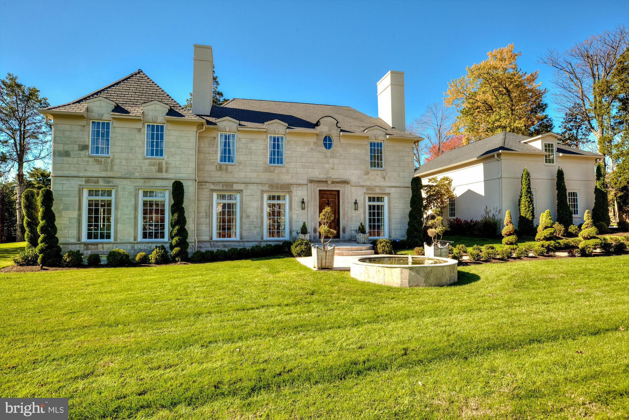 Stunning 8,000sqft custom residence perfectly sited on beautifully landscaped level lot w/pool.   Clad in limestone, this timeless home features a modern flr plan, perfect for elegant entertaining & casual family living.  Gorgeous marble kitchen, sun-filled family room, spacious master suite boasting his & hers bathrooms.  Covered porch w/fireplace.  Outdoor kit. Guest suite above detached garage.