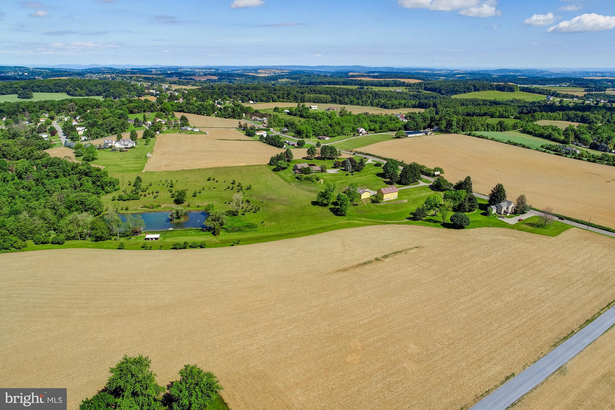 Explore the possibilities this 161.5 acre property located in both Windsor and Chanceford Townships has to offer. Residential and Agriculturally zoned. Gorgeous and peaceful with rolling acreage. Located less than 10 minutes to small-town Red Lion Boro, Quick commute to I83, Shrewsbury and Glen Rock Exits. Road frontage along Rt74/Delta Rd, Zimmerman Rd and W Snyder Corner Rd. Most public utilities available. Currently property consists of 4BR, 3.5BA sprawling ranch-style stone home with 2nd floor, 3-unit tenant occupied farmhouse, wood/stone barn, pole building and large pond with dock, outhouse, fountain and its very own island. Site Design Concepts subdivision plan has been approved by Windsor Twp.  AGENTS - Please Read Agent Remarks.