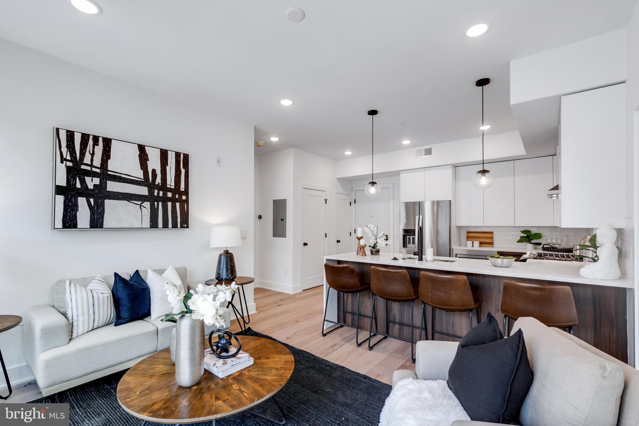 Discover the epitome of luxury living in the heart of Francisville at The Vine, nestled on Francis Street. Unit 3C is a 2 bedroom and 2 full bathroom 1200 square foot luxury condo with expansive floor-to-ceiling windows that flood the space with natural light. Enjoy the ease of secure garage parking and a shared roof deck in this boutique condo building.   The focal point, a spacious kitchen adorned with two-tone UltraCraft cabinets, pristine white quartz countertops, Delta Trinsic matte black fixtures, and Whirlpool stainless steel appliances. Indulge in the comfort of generously appointed bedrooms featuring custom-built closets, while designer tile, Gatco Latitude II Accessory Series, Delta Trinsic matte black fixtures, and UltraCraft custom vanities adorn every bathroom. Modern conveniences abound, including a NEST thermostat, secured entry systems, mail room, bike room, trash room and exterior cameras.  Schedule a tour today and envision yourself at The Vine.