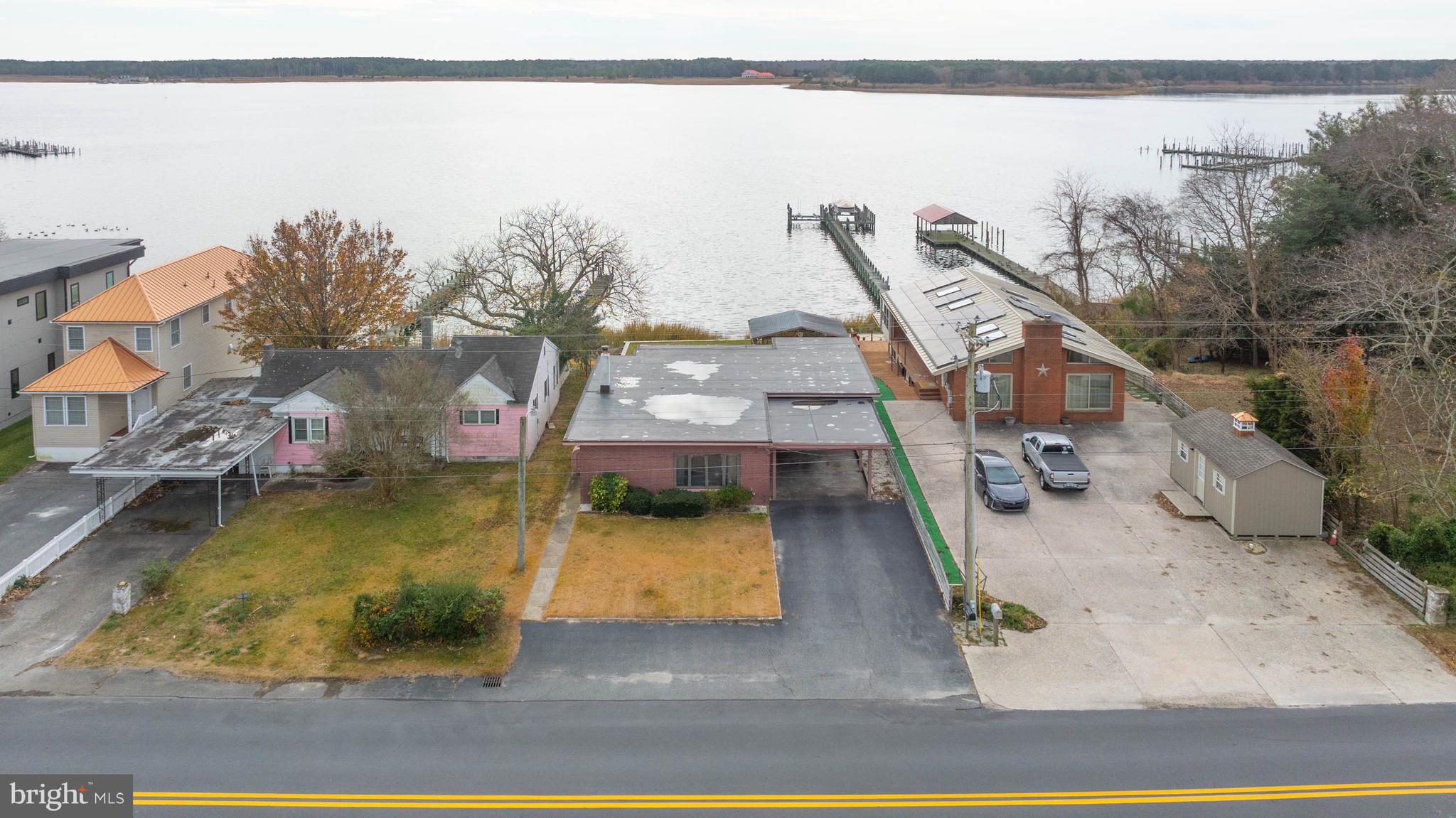 Looking for waterfront a home?  Offering 2 bedrooms, 2 baths, and carport. Welcome to your waterfront Paradise with an oversized living room area and vintage kitchen.  Off the kitchen area is dining area/sitting space for entertainment.  Located to the back of the home is a 3-season room with killer water views.  The separate exterior screened porch with storage below opens to the new bulkheading and spacious lot.  This one-of-a-kind property is ready for you and your family.