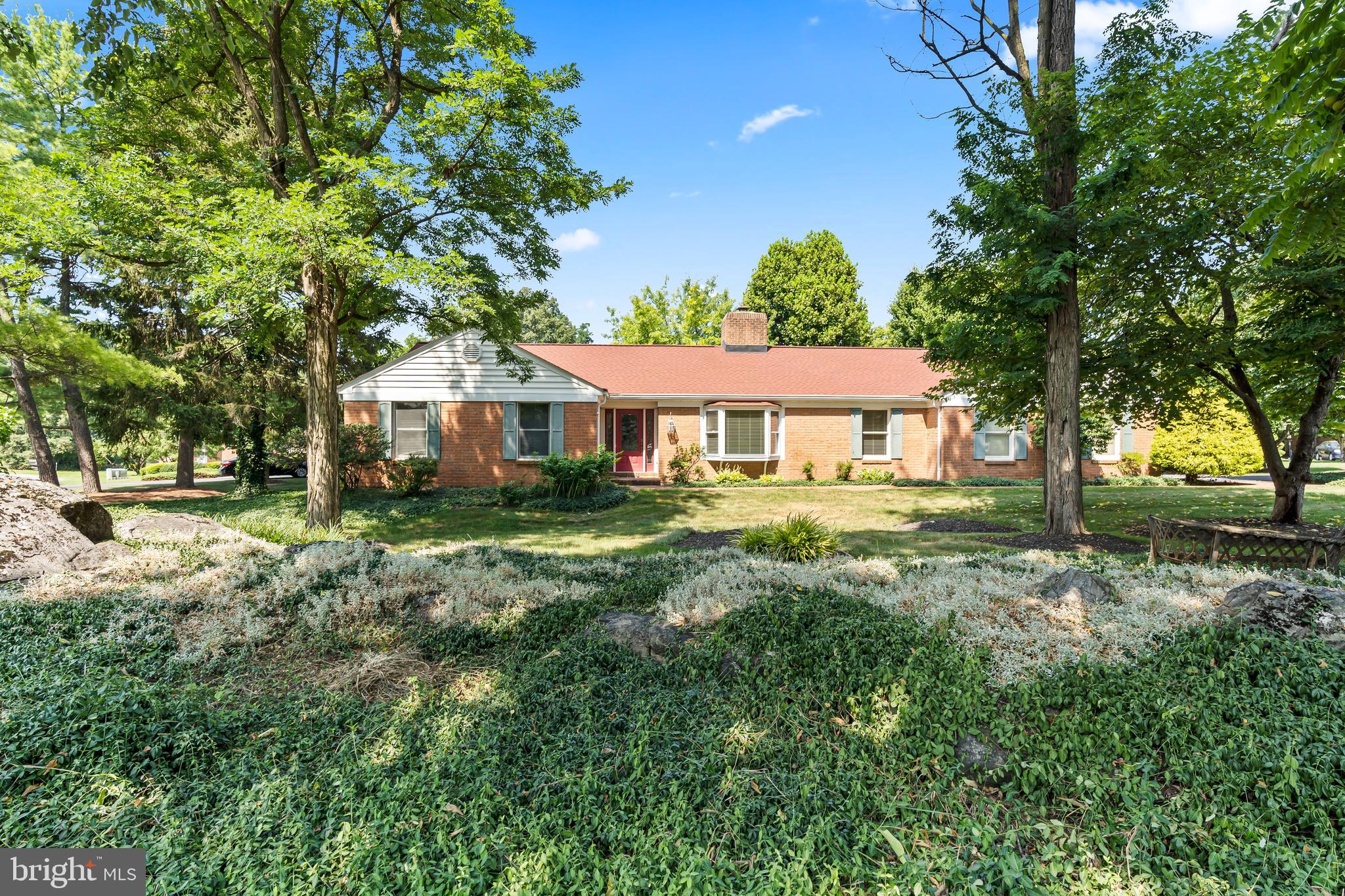 Beautiful corner lot rancher with mature landscaping in Brightwood Acres.  Whether you want to be outdoors or indoors this home has plenty of space.   Enjoy time by the fireplace relaxing in the family room or watching the big game in the bonus recreation room.  Step outside from the year-round sunroom into the large yard with porch and patio for relaxing or entertaining.  Updated kitchen and bathrooms and hardwood floors throughout.  This home was freshly painted and had a new stainless refrigerator, microwave, and stove in 2025.
