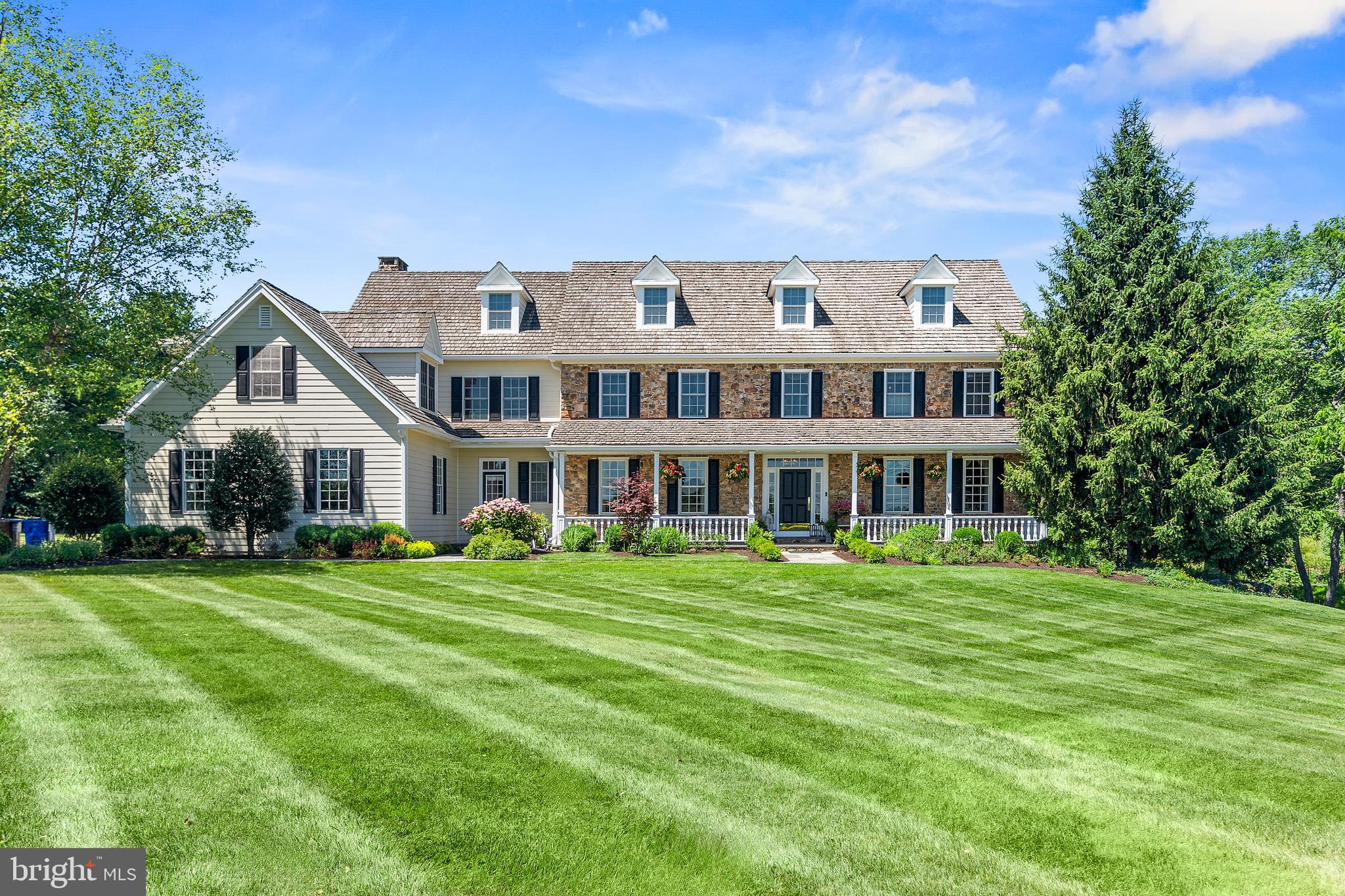 Discover a once-in-a-lifetime opportunity to own a Ferman Lex home, crafted by one of Bucks County's most esteemed builders. This luxurious 5-bedroom, 6-bathroom center hall Colonial is nestled on 2.7 acres of picturesque farmland in prestigious Upper Makefield, offering over 8,900 square feet of refined living space. Exquisite craftsmanship is evident throughout, from intricate dentil crown moldings to solid hardwood floors. Soaring 9'-foot ceilings and large windows bathe each room in natural light, while soft, warm colors create an inviting ambiance. The heart of the home is its gourmet kitchen, featuring a gleaming granite countertop, energy-efficient appliances, and a 6-burner gas range with a center grill and dual ovens. An adjoining patio provides grand views of the expansive property, perfect for morning coffee or evening relaxation. The thoughtful layout caters to both everyday living and elegant entertaining. A formal dining room with butler's pantry sets the stage for sophisticated gatherings, while the open kitchen, family room, and breakfast nook combination creates a warm space for casual moments. A large first-floor office provides a quiet retreat, and two brick gas fireplaces add to the home's overall warmth. Five separate zones of environmental control ensure comfort for everyone throughout the year. Upstairs, the primary bedroom suite boasts an elegant dressing room with built-in dressers and ample wardrobe space including built-in shelving and glass door closets.  A second-floor laundry adds convenience, while four additional bedrooms and two full bathrooms complete the upper level. The finished basement spans a massive 3,173 sq. ft., featuring a Bar, Exercise Room, Theater, Storage and Hobby area.  An additional 1,657 sq. ft. of finished attic space offers endless customization possibilities. Extensive hardscaping and beautifully designed outdoor spaces enhance the property's allure. The three-car garage, equipped with 220-volt service for electric vehicles, adds a modern touch, while durable Hardie Board siding ensures longevity and low maintenance. Situated within the award-winning Council Rock School District, this home promises an exceptional educational experience. Set against a backdrop of serene streams and abundant wildlife, this Ferman Lex masterpiece seamlessly combines luxury, functionality, and natural beauty, making it the perfect haven for those seeking a prestigious lifestyle in Bucks County. Conveniently located minutes from the charming towns of Newtown, New Hope, and Washington Crossing, this home provides easy access to I-295, Princeton, New York City, and Philadelphia