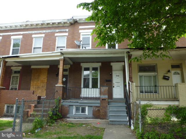 Bright and spacious, previously renovated classic, porch front Baltimore rowhome  with the grass yard in the front, fenced in backyard, forced air gas heat, gas water, pergo  flooring, eat in kitchen. Property is sild in strictly AS IS, WHERE IS condition. Property is believed to be FEE SIMPLE however if ground rent is found, the seller shall not redeem. $5,000 EMD, POF and corp docs showing ownership and who is authorized to sign is a must.