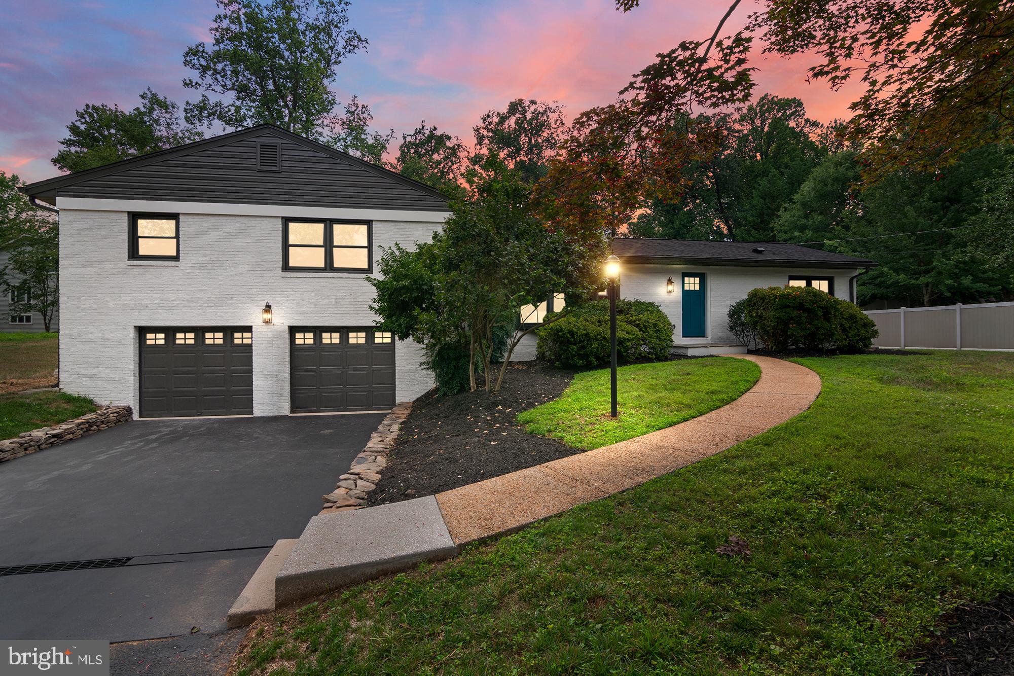 Welcome to 14200 Dav Rd, Rockville, Maryland, an extensively renovated 4- bedroom, 3-full bath rambler offering approximately 2,500 square feet of living space on two beautifully finished levels. Perfectly positioned on a half-acre lot, this home combines thoughtful updates, modern comfort, and a prime location. The main level features three spacious bedrooms and two fully renovated baths, along with a stunning new kitchen showcasing white shaker cabinets, quartz countertop with waterfall feature, custom hood vent and stainless-steel appliances. A dedicated coffee bar and new stacked laundry center add both function and convenience. The open living and dining areas are bright and inviting with hardwood flooring, updated fixtures, and ample recessed lighting. Sliding doors lead to a stone patio w/ exterior fireplace that overlooks the large and level rear yard. The rear yard is fenced — perfect for outdoor dining and relaxation. The fully finished lower level offers a family room equipped with a wet bar, a den/bedroom, a renovated full bath and laundry area. There is a laundry chute located in the primary bedroom closet for added convenience. Parking is generous with an oversized two-car garage, a driveway accommodating four vehicles, and plentiful street parking. Other updates include a new roof, new windows, new hvac equipment, new whole house water filtration system and new septic tank. The location is exceptional — close to Lakewood Country Club, several parks with playgrounds, walking trails, and sports courts, and just minutes to Trader Joe’s, Safeway, and all the dining and shopping options of Downtown Rockville, RIO Lakefront, and Kentlands. Served by Lakewood Elementary, Robert Frost Middle, and Wootton High School, this home truly checks every box for comfort, convenience, and lifestyle.