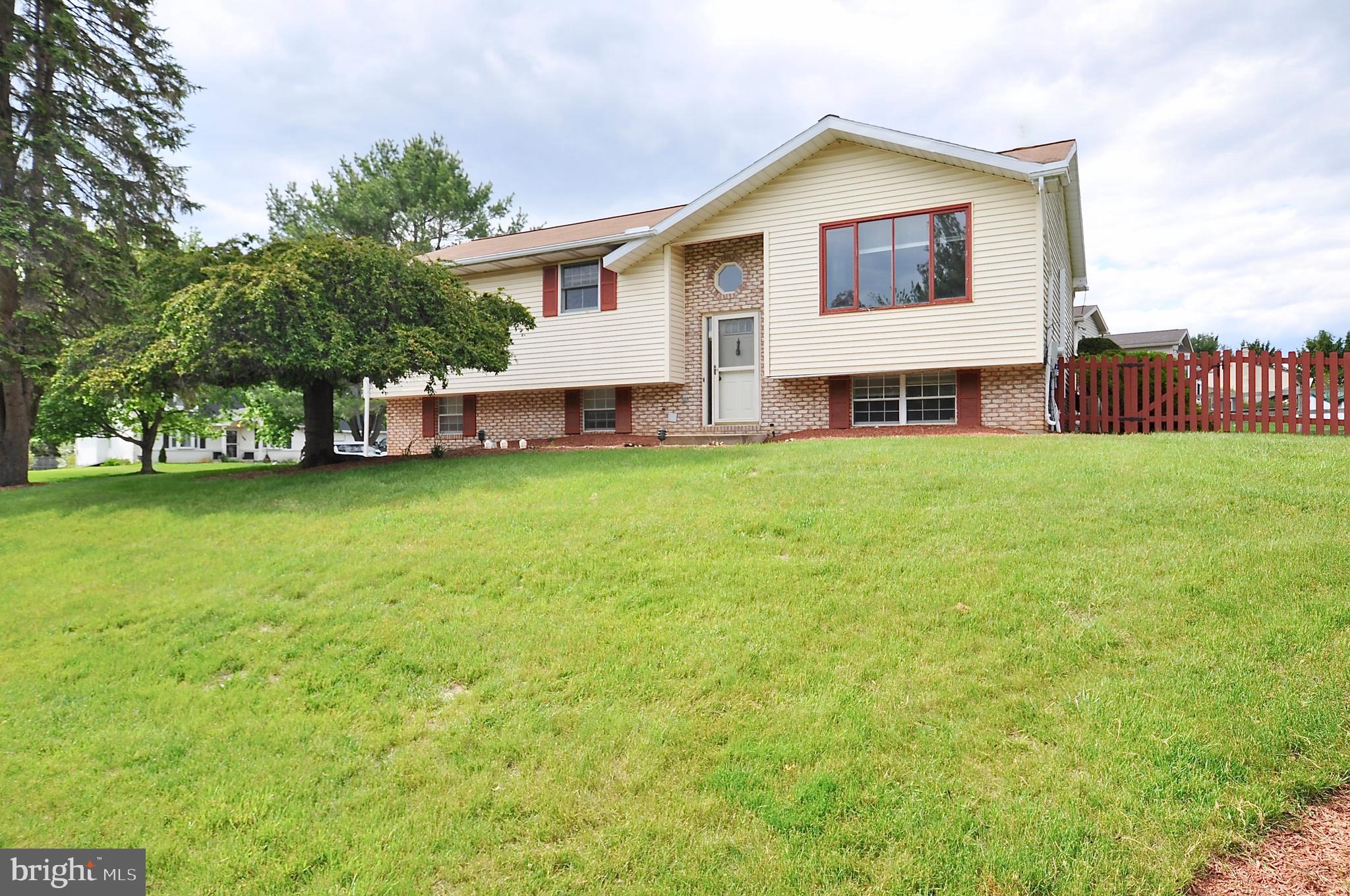 Wow! This bi level home on the quiet corner of Andover and Berwick in wonderful Willowbrook Estates, just east of Boalsburg Village, is on the market and ready for you! Inside you will a find large living room, kitchen and dining are, 3 bedrooms and 2 full baths on the main level. Downstairs is a huge recreation room, laundry and 1/2 bathroom. Large rear deck, fenced in back yard. Huge driveway with 2 garage doors but only 1 bay as additional finished area encroached into the other bay. This is a very sought after neighborhood. Do not wait. See the photos, see the house and make it yours before someone else does. Please note existing satellite dish was removed from lead photos for marketing purposes and to show how beautiful the face of this home could be if dish were removed. Very last photo shows existing satellite. This is what you will see when you pull up in person for your showing.
