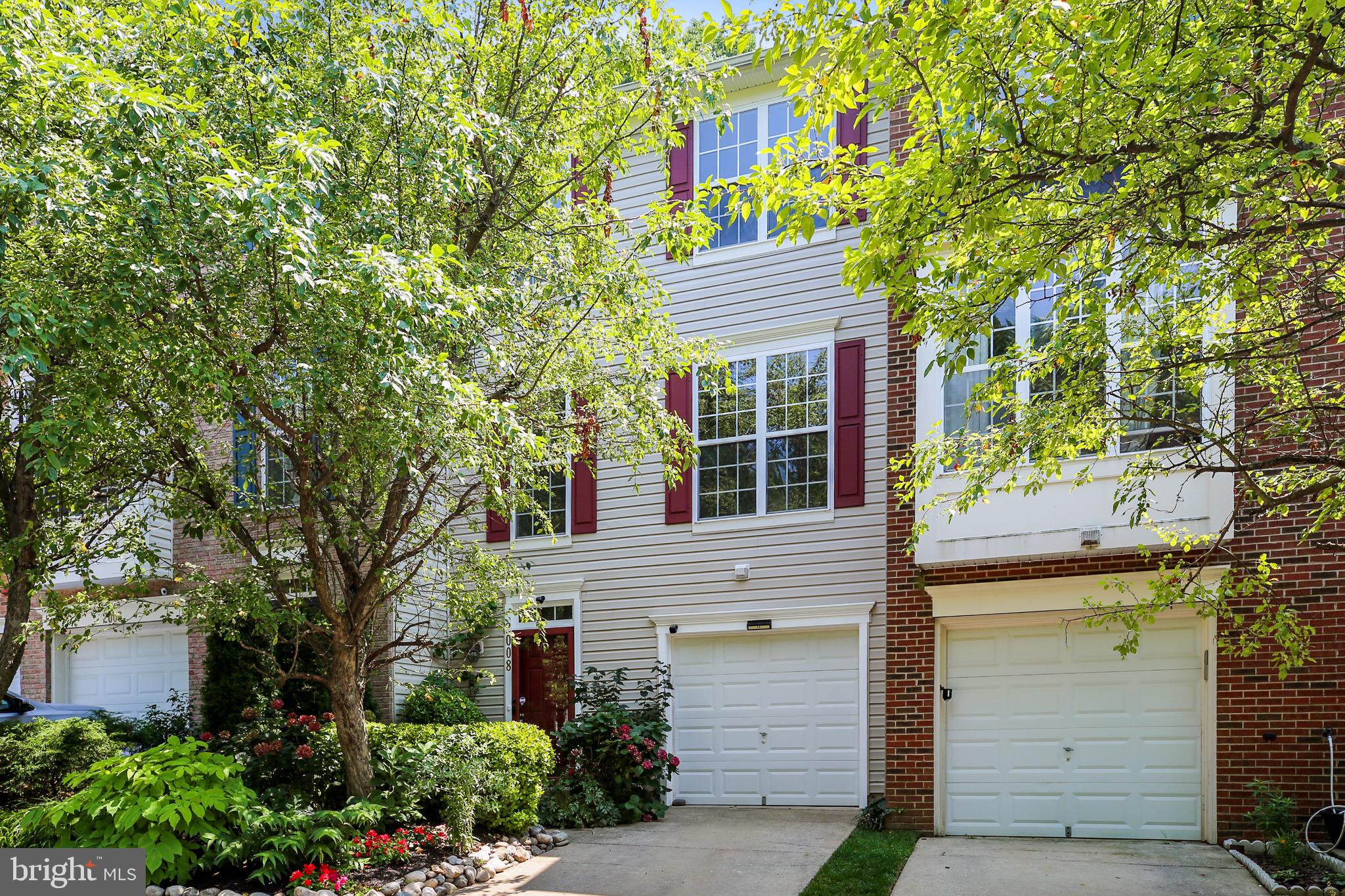 3 level townhome on a quiet cul de sac in a park like setting features two story foyer & open concept living room & dining room.  New carpet & fresh paint.  Kitchen has stainless appliances, breakfast bar & table space.  Owners suite has a cathedral ceiling, walk-in closet, double vanity, soaking tub & a separate shower.  Family room with gas fireplace, & access to large backyard & garage parking.  Walk to  Wheaton metro, restaurants and shopping.  Newer HVAC and water heater.