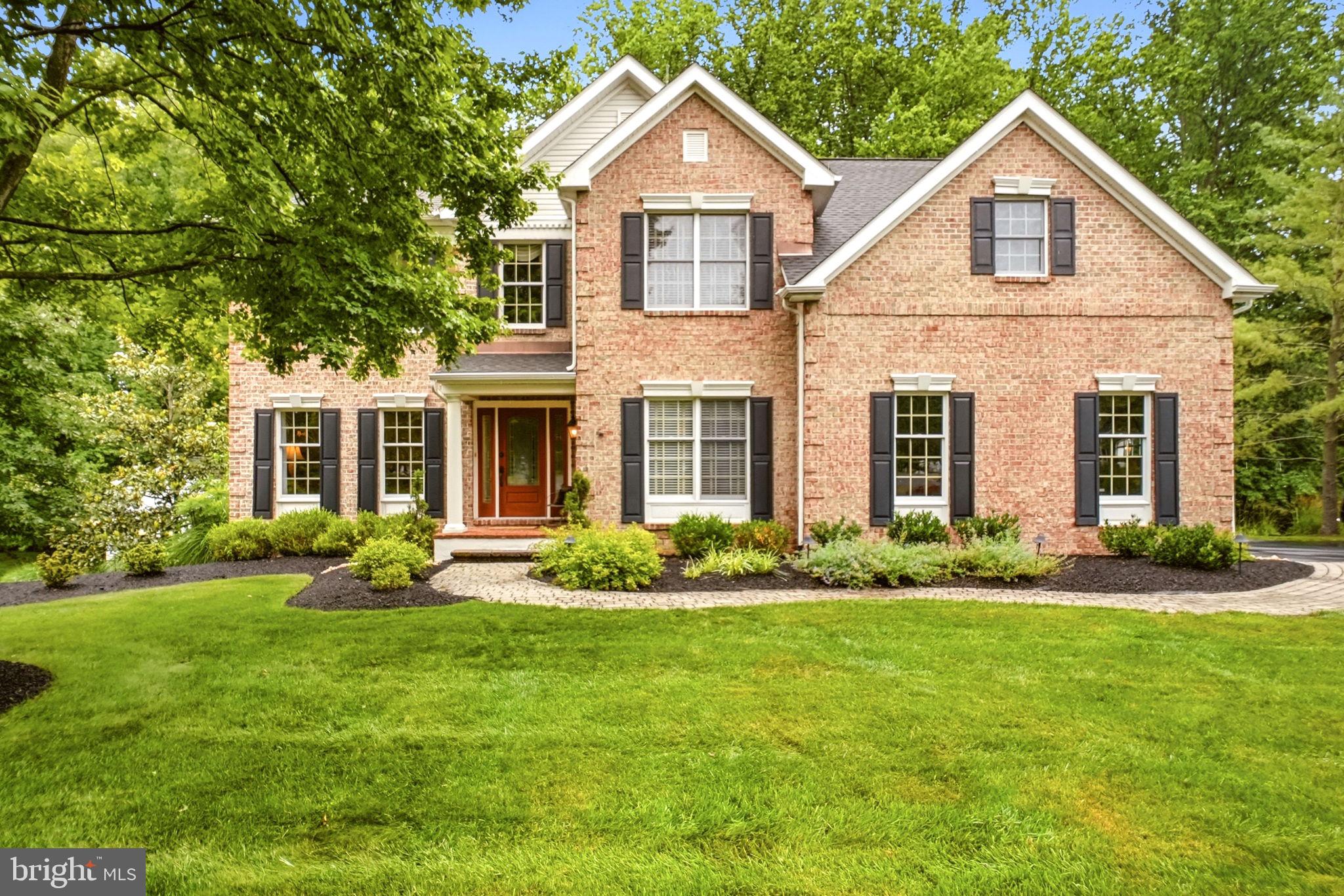 This stately single family home offers exceptional living both inside and out, featuring dual staircases, a spectacular backyard oasis with an in-ground pool, fountain, expansive Trex deck, 42" LINX grill, and pool house complete with a wet bar and full bath. The owners spared no expense in creating a truly remarkable home, highlighted by gorgeous interior and exterior lighting, extensive remodeling, and quality upgrades throughout.
Step into the dramatic two-story foyer featuring elegant wainscoting and a turned staircase. The entire first floor showcases beautiful new hardwood flooring and includes a private office with built-in cabinetry, formal living room, and elegant dining room with a bay window. The impressive two-story family room features a floor-to-ceiling stone fireplace, skylights, ceiling fan, and wet bar, creating the perfect space for entertaining. The gourmet kitchen offers a center island, Wolf range, double ovens, pantry, and opens to a bright breakfast/sunroom with ceramic tile flooring overlooking the private backyard retreat. Completing the main level are a first floor laundry room with built-in cabinetry and utility sink, and access to the spacious two-car garage.
A second rear staircase off the family room provides additional access to the upper level, where hardwood flooring continues throughout the hallway. The luxurious primary suite features a shiplap accent wall, ceiling fan, walk-in closet, sitting room, and a beautifully remodeled spa-inspired bath with double vanity, a luxurious freestanding soaking tub, seamless glass shower, and designer ceramic tile. The second and third bedrooms each feature ceiling fans and share a beautifully renovated Jack and Jill bath. The fourth bedroom serves as a private suite complete with its own full bath and walk-in closet. The finished walkout lower level is an entertainer's dream, featuring hardwood flooring, a gas fireplace, custom built-in bar, extensive built-in cabinetry, exercise room, abundant storage, and direct access to the pool area. Additional highlights include a house generator, front yard sprinkler system, gas line for outdoor grilling, and countless updates throughout. This exceptional Concord Chase residence seamlessly combines luxury, comfort, and resort style outdoor living in one of Glen Mills' premier neighborhoods. Situated within the highly acclaimed Garnet Valley School District, the home's convenient location provides easy access to Philadelphia International Airport, I-476, King of Prussia, and Delaware. A truly extraordinary property offering an unmatched lifestyle both inside and out.