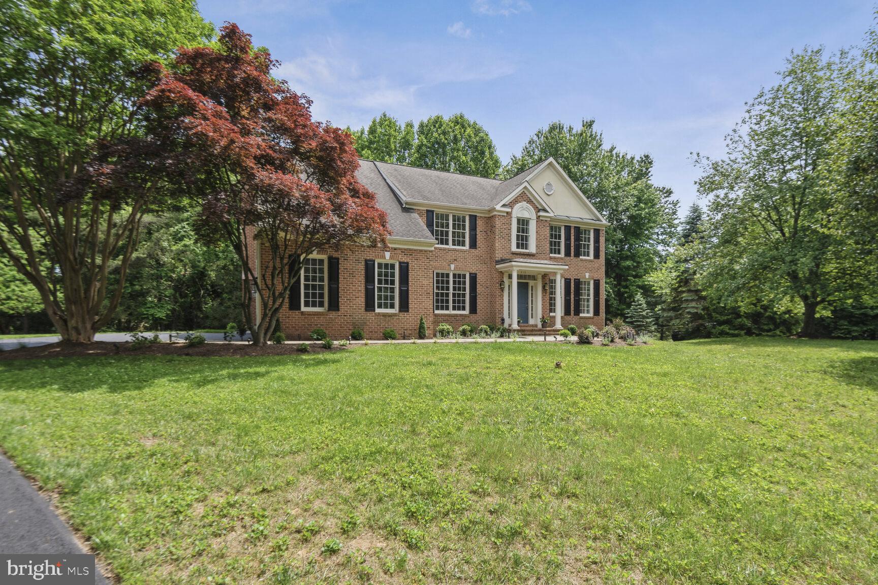 This stunning home blends colonial style and an open concept layout, providing the perfect balance. Greet your guests at the front door; welcome them into the formal living and dining room. Then, step through to the back of the home and find an open floor plan with an expansive, sun-filled family room with a cozy gas fireplace; a breakfast room; a refreshing, screened porch; and the newly updated, custom kitchen. The main floor also has a comfortable office that is nicely tucked away in a sunny corner.  Unlike many homes in the area, there is no need to step up, or step down as you move from room to room.  In the upper level, the primary bedroom and bathroom enjoy privacy from the other three bedrooms on that level.  The second bedroom has a private bath, while the third and fourth share a jack-and-jill bathroom.  All have been updated – new cabinets, counters, and fixtures. The laundry is conveniently located on this bedroom level.  The lower level hosts a generous rec room; the fifth bedroom and a full bathroom.  The hardwoods have been re-finished throughout the house; the rooms are freshly painted in tasteful neutrals; and the bedrooms have new carpeting.  The yard is fairly level, sloping gently away from the house. The new landscaping (not currently pictured) will provide years of minimal maintenance for the new owner.  A new driveway just installed.