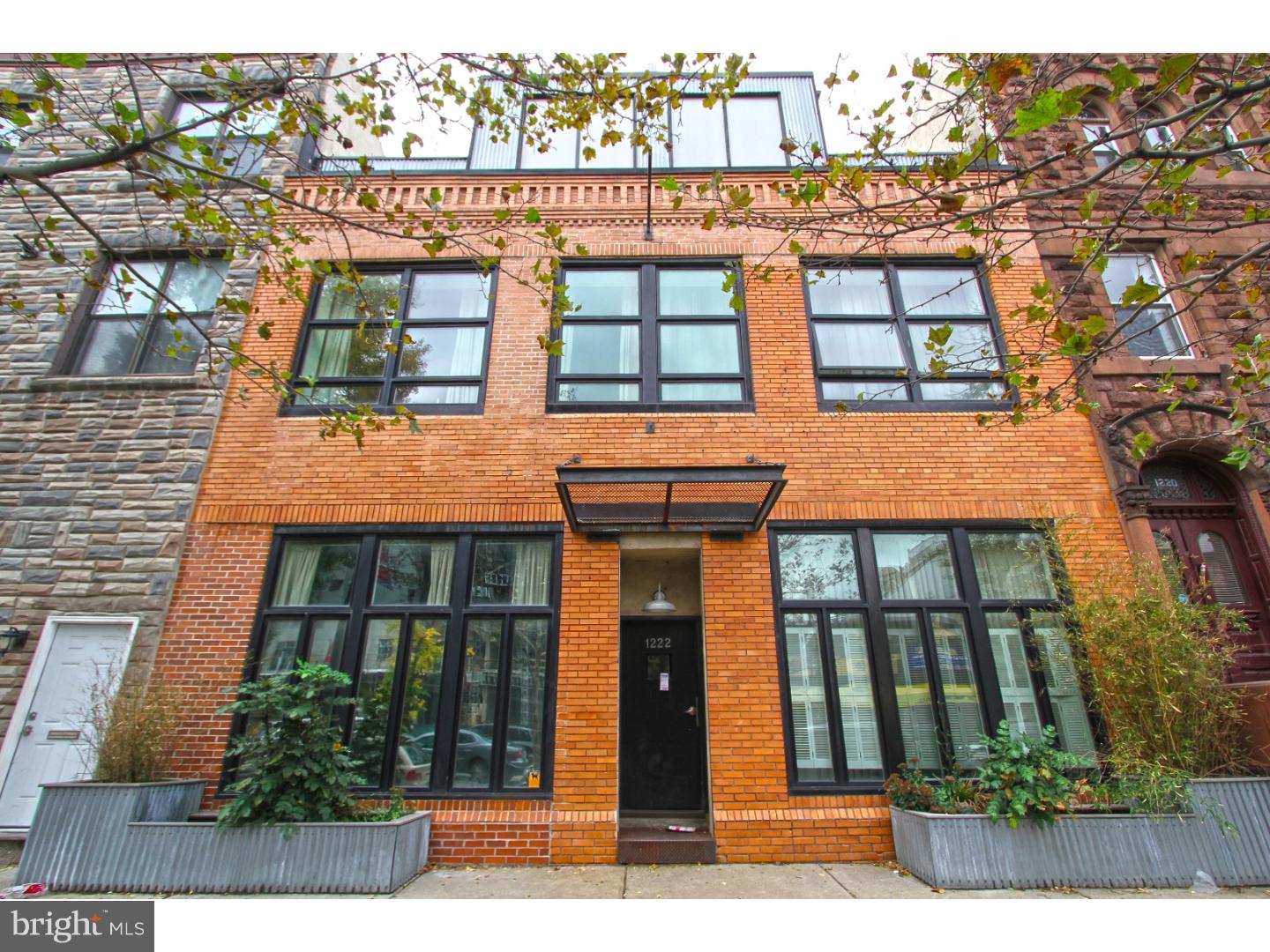 Welcome to this fabulous NY style LOFT condo with attached GARAGE PARKING in thriving location. This open and bright floor plan features new hardwood flooring throughout, a modern spacious living/dining area with soaring ceilings and exposed steel beams. There is a state of the art kitchen with granite countertops and stainless steel appliances.  Plenty of counter space ! There is a contemporary first floor powder room. A spiral staircase leads to an expansive master bedroom with walk in closet, full bath and laundry. Third level has storage area and roof access to enjoy center city views and have a roof deck for the future.   Tons of natural light flows into the unit from the expansive windows. Located on the Avenue of the Arts, enjoy walking to theaters, shops, and restaurants and immediate proximity to public transportation.  Can access via front door on Broad St or private entrance via the garage parking lot.  Super low real estate taxes - approximately 3 years left on the tax abatement. We welcome your visit today!