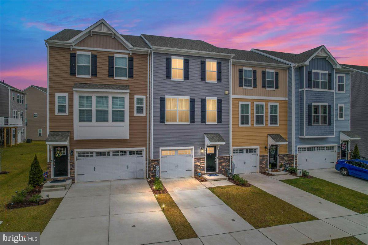 Do not miss this stunning 3 level, 2020 Sage Homes, garage-townhome that has been lovingly maintained by its current owner! Location, location, location! Enjoy spacious townhome living with 4 bedrooms, 3 full bathrooms,1 half bathroom and a one-car garage! This model boasts light-filled rooms, 9ft ceilings, modern light fixtures, and more! The first level in-law suite or family room is complete with a full bath and walk out to what could be a fabulous patio facing the tot lot! Make your way to the upper level where you'll find a refreshing cross breeze from 3 mirroring windows from front to back of the home. A bright and gorgeous kitchen with stainless steel appliances awaits your dinner parties including an island with granite countertops and plenty of prep space. The open floor plan flows into the living room and out to your new favorite spot...the deck. From the deck you have a front row view of the tot lot and recreational areas. Find your additional 3 bedrooms on the upper level. Enjoy laundry with a short walk from the washer and dryer to the closet with upper level laundry ease. Your primary bedroom boasts an enviable walk-in closet, the perfect amount of natural light, and large primary bathroom. 7254 Martin Farm Circle is eagerly awaiting its next owner to make it their own!