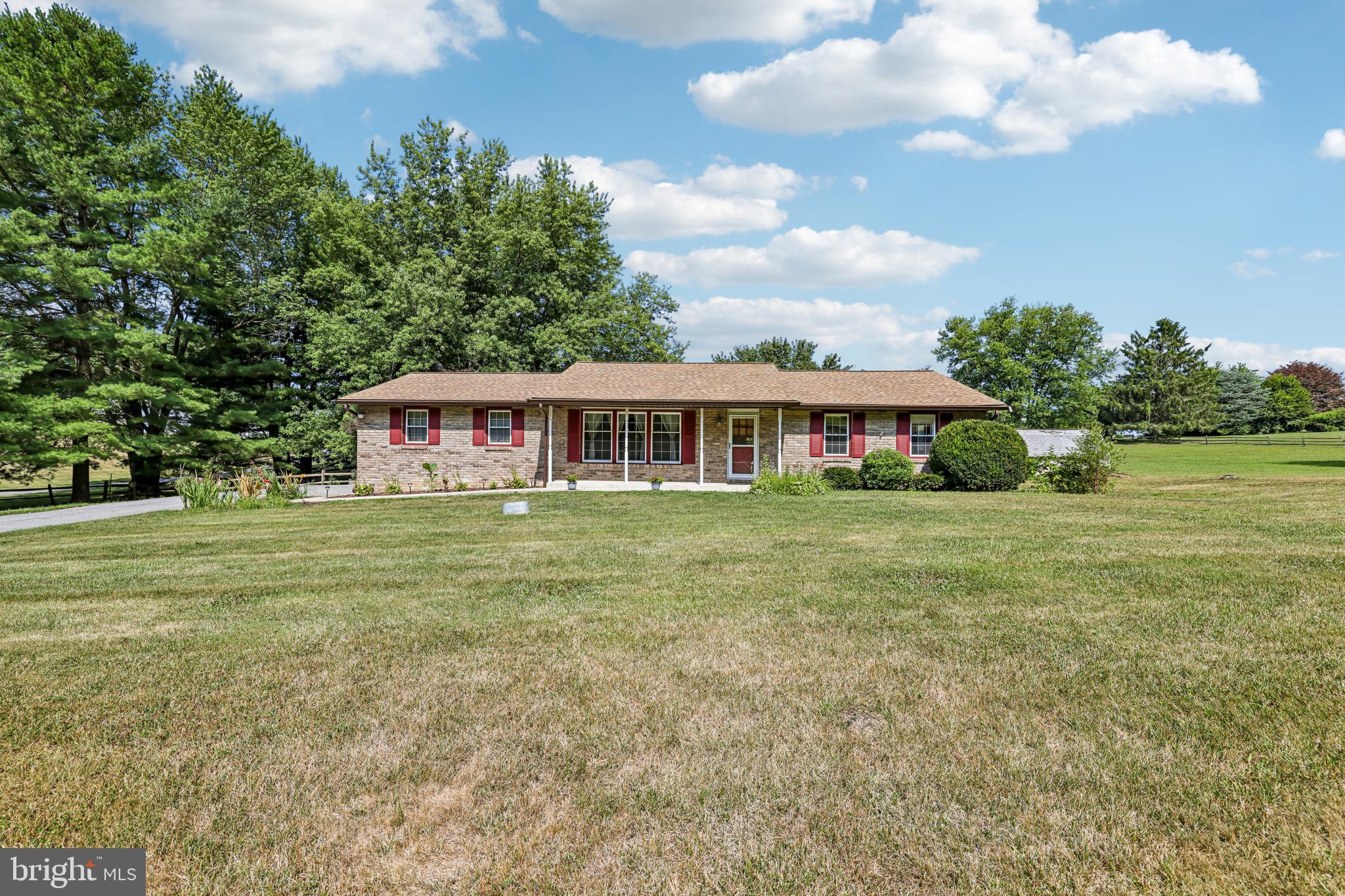 Welcome to 304 Blue Grass Lane in Hampstead, where comfortable single-level living meets the versatility of a picturesque 3.18-acre property. This detached ranch-style home offers three bedrooms and two full bathrooms, along with a spacious layout designed for everyday living and entertaining. A bright sunroom provides an inviting space to relax while enjoying scenic views of the surrounding property, and the expansive lower level offers abundant space for storage, recreation, hobbies, or future customization.

Recent improvements provide added value and peace of mind, including a radon mitigation system (2026), new luxury vinyl plank flooring throughout the lower level (2026), a new stainless steel refrigerator (2026), water heater (2024), basement waterproofing (2022), and a roof replacement (2020).

Outdoors, the 3.18-acre property is thoughtfully equipped with a stable, pole barn, loafing barn, machine barn, woodshop, and metal shop, offering exceptional flexibility for a variety of permitted uses, projects, equipment storage, or workshop needs. With a unique combination of indoor comfort, functional outbuildings, and generous open space, this property presents a rare opportunity to enjoy country-style living while remaining conveniently located near local amenities, shopping, dining, and commuter routes.