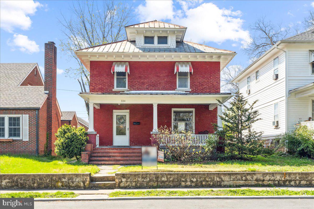 Welcome to this beautifully maintained 4-bedroom, 1-bath American Foursquare home, full of timeless charm and solid all-brick construction. Featuring original pocket doors, high ceilings, and classic architectural details, this home seamlessly blends historic character with modern convenience.

The interior has been thoughtfully updated, including modernized electrical and plumbing systems, while preserving the warmth and elegance of its original design. Fresh finishes and a smart layout make the space both stylish and functional.

Lovingly cared for, this home has been operated as a successful Airbnb for years—, it has been immaculately maintained and is truly turnkey. Whether you're looking for a primary residence, a second home, or an investment property, this one checks all the boxes.

Enjoy the spacious backyard and covered back porch, ideal for relaxing or entertaining. Plus, you're just minutes from the train station and local downtown shopping and restaurants, offering unbeatable convenience in a central location.

Don’t miss the chance to own this rare gem that combines vintage charm, modern updates, and proven income potential.