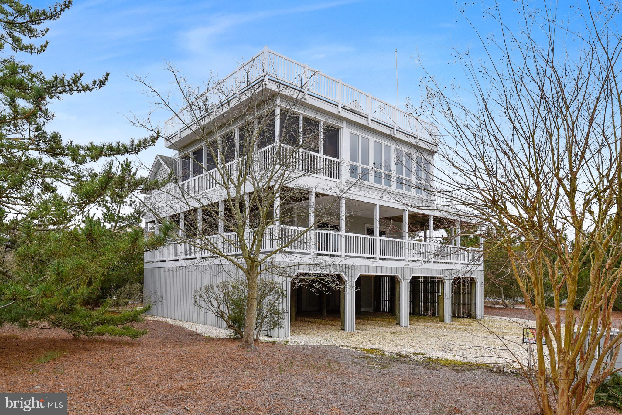 Check out the awesome updates recently made to this home to include all new flooring, new kitchen cabinets / counters / appliances, freshly painted and a new primary bathroom shower.   Welcome to your new beach home with five bedrooms and four and a half-baths located in the beautiful and amenity-rich community of Cotton Patch Hills in North Bethany. Stroll down the beautiful off-street walkway from this ocean block coastal home to create endless memories at the private beach, and meander over to the marina and boat ramp for your bayside enjoyment.   You are just yards away from the beach, a pleasant few steps on a newly upgraded path from the home to the sand. 
 After a day at the beach or on the bay, rinse off in the outdoor shower, enjoy a cocktail on one of the many decks or inside the three-season room, then relax in your hot tub! On the main level, this home features four bedrooms and three baths, one an ensuite. The washer/dryer, a large walk-in closet, and a wraparound deck complete this level. With an inverted floor plan, the top level is open, airy, and inviting, featuring a large great room/dining space, ideal for friend and family gatherings, and a kitchen complete with new stainless steel appliances. The spacious primary master ensuite is complete with a Jacuzzi tub/shower and, as many of the bedrooms, has access to its own deck for peaceful outdoor living. Outdoor leisure can be enjoyed on the many decks around the house, on the beach, at the bay or at the community tennis/pickleball court. Wind up on the Skytop deck to witness the most incredible and stunning views of the sunset, or start here in the mornings to watch the sunrise.
 Situated on an oversized corner lot nestled among a cove of trees, this home provides all the comforts a beach life offers, and the privacy and space to create a resort-style backyard with your own private pool should that be part of your dream. This property has rental income of over $100K per year.