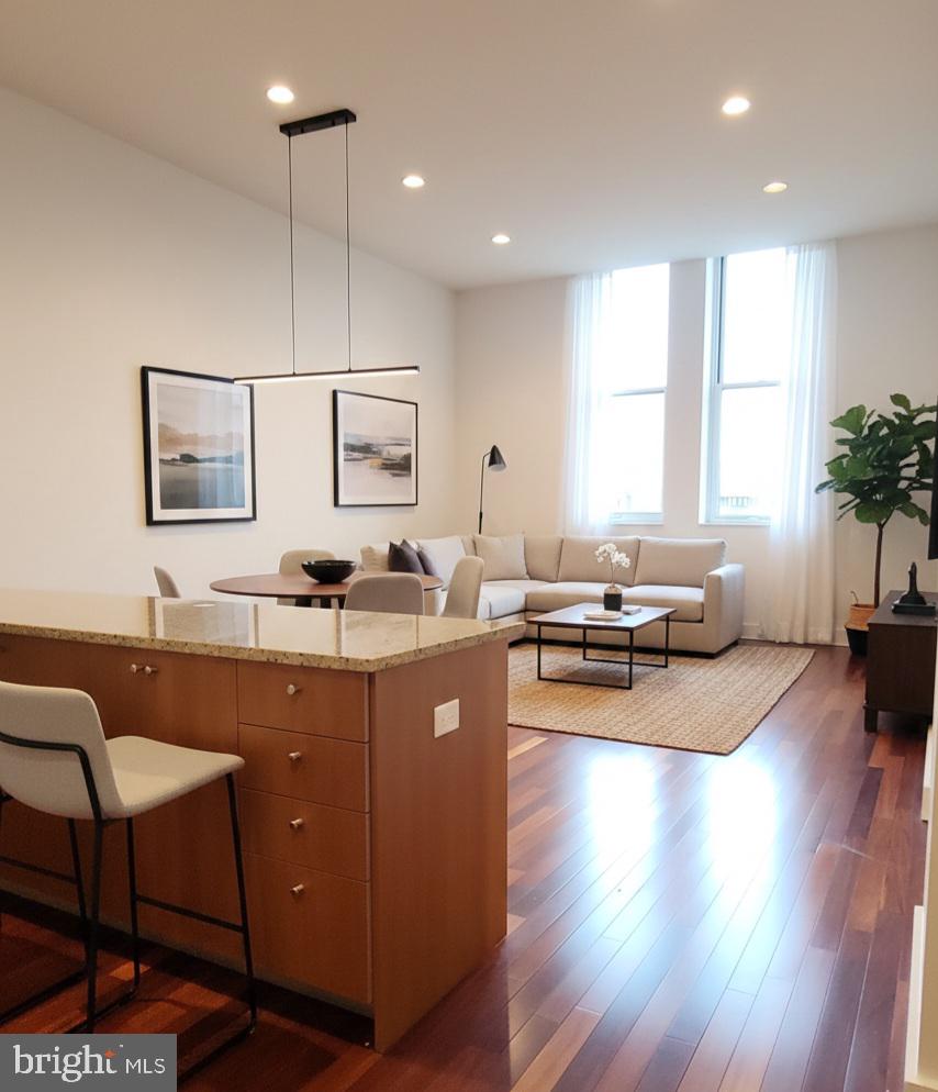 Huge light filled one bedroom plus den. South facing, 14 ft ceilings, lots of room, gas cooking in a luxury doorman building. Parking  for a sedan license 30,000 or 80,000  for a suv license has 250/mo monthly fee. One storage unit included on the third floor. Some images are virtually staged and enhanced.