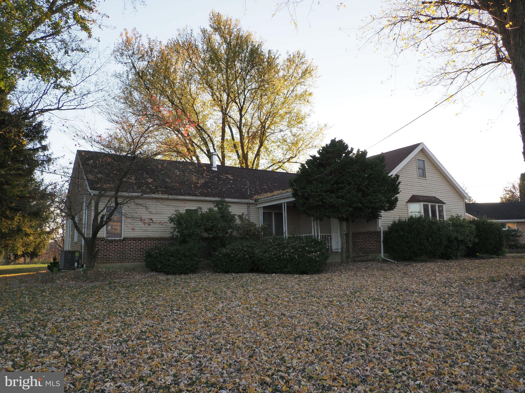 Need space?  Whether it be your big circle of friends, a couple of antique cars needing garage space, or that quilting frame you want to use, this house has room for all!  Set back nicely on a mature 1.24 acre lot, you will love hosting family picnics, playing volleyball with your friends, and relaxing after a hard day at work with a good book on the beautiful paver patio.  Having potential for multi-generational living, the first floor offers a 23 x 18 LR, large DR with hardwood floors, and almost new kitchen with 42 inch cabinets with pull-outs, gleaming appliances, tile floor, granite countertop, and tile backsplash.  There are also 3 BR on this level with decent closet space including a large walk-in and 2 newer bathes with beautiful cabinetry, tile floors, and tile shower/surround.  You will also enjoy relaxing in the 4 season room (great for the plant lover) which leads to an outside deck.  Upstairs is another full bath and an L-shaped bedroom which would make an idea home office or dressing room as well as a 21 x 15 foot bedroom--take over the whole second floor as your master suite getaway!!!!  Large 3 bay detached garage with storage above--ideal for your Rav 4 , your 66 Mustang, and the workshop of your dreams!  Make an appointment today!