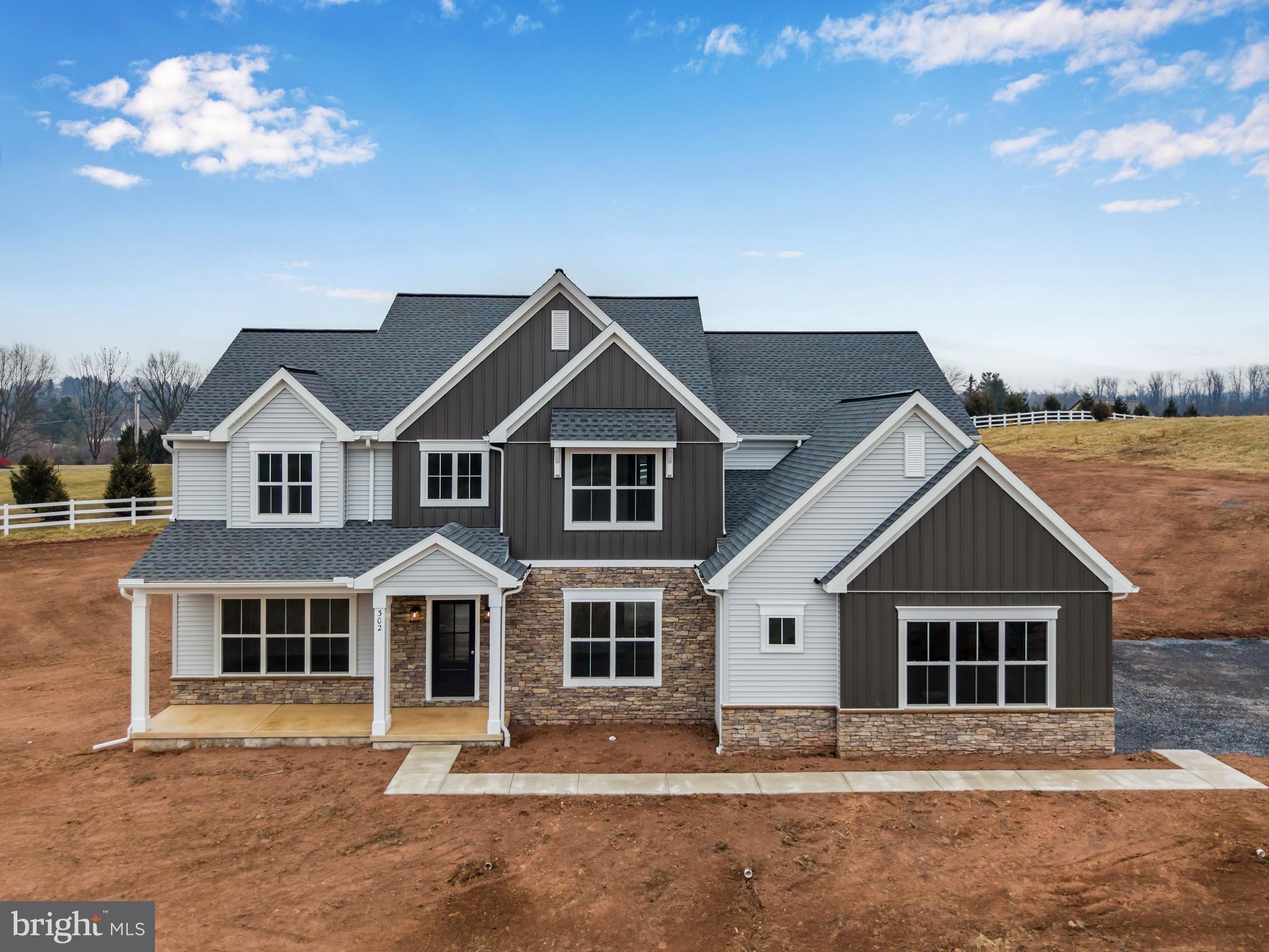 UNDER CONSTRUCTION – AVAILABLE SPRING 2026: This grand 2-story home features 9’ ceilings on the first floor and a 3-car, side-load garage with mudroom entry. The mudroom is complete with built-in lockers, a powder room, and a large pantry. Upon entering the home, the 2-story foyer is flanked by a formal dining room to the right and a living room and carpeted study to the left. Stylish vinyl plank flooring extends throughout the rest of the first floor. The well-appointed kitchen boasts enhanced appliances and cabinetry, quartz countertops with a tile backsplash, a wide center island, and a breakfast nook. Sliding glass doors off the kitchen provide access to large patio, perfect for outdoor entertaining. The great room is warmed by a gas fireplace with beautiful stone and craftsman trim detail. Take the convenient staircase with access in both the foyer and kitchen to the second floor complete with laundry room, 4 bedrooms and 3 full bathrooms. The owner’s suite includes a tile shower, a double bowl vanity, and an expansive closet.