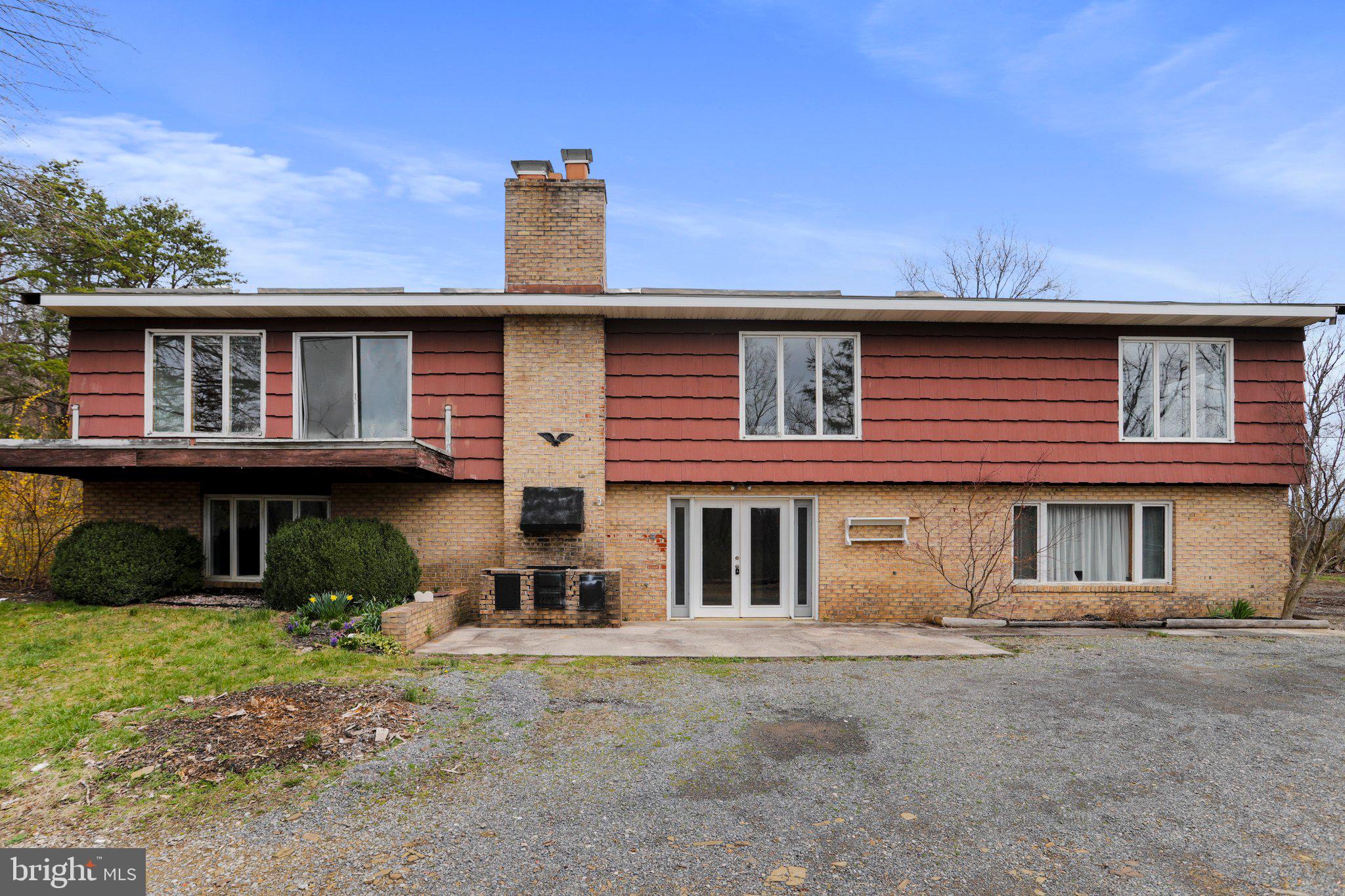Positioned perfectly on a sprawling 2.21-acre parcel of partially wooded land, this charming fixer-upper offers a unique opportunity for renovation and customization. Constructed in 1972, the expansive 3,280 sq. ft. residence features three spacious bedrooms and two and a half bathrooms, providing ample space for comfortable living. Inside, you'll find two warm fireplaces, a massive kitchen layout, along with an area that was once an attached garage - ripe for transformation with a bit of creativity and effort. One of the property's standout features is its tranquil and private setting, free from the constraints of homeowner's association regulations and fees. Surrounded by nature, you'll enjoy the peace and seclusion of country living while still being conveniently located under an hour's drive from bustling Cumberland, MD, and Winchester, VA. Whether you're dreaming of modern updates or preserving its classic charm, this home offers endless possibilities for customization and improvement. Don't miss your chance to turn this diamond in the rough into your ideal retreat. Property being conveyed strictly "As Is".