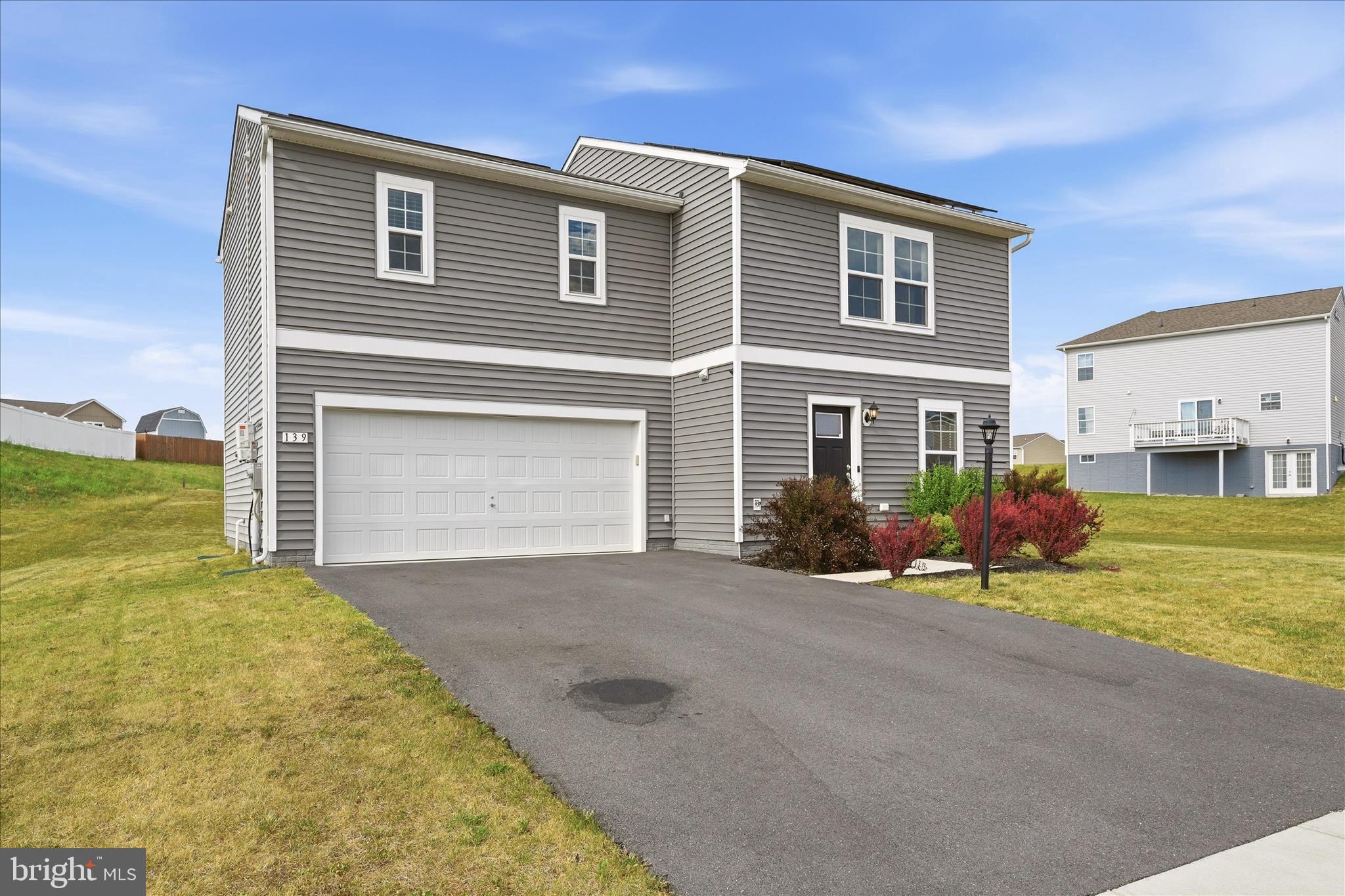 Welcome home to this beautifully maintained 4-bedroom, 2.5-bath residence in desirable Bunker Hill! Featuring an open-concept main level, this move-in-ready home offers the perfect blend of comfort and functionality. The spacious layout is enhanced by durable LVP flooring and abundant natural light, creating an inviting atmosphere for everyday living and entertaining on the Main-Level. In the Kitchen you'll find stainless steel appliances, granite counter tops, upgraded cabinetry, and a functional Kitchen island. Upstairs you'll find the Primary Suite, which  provides a private retreat with its own en-suite bath, and walk-in closet. Down the hall you'll find 3 additional Bedrooms that offer plenty of space for family, guests, or a home office. This adorable Home also has updated fixtures that just add to its charm and character.  
A 2-car garage adds convenience and storage. Energy-efficient solar panels help reduce utility costs, making this home as practical as it is attractive. Situated on a spacious lot of over a 1/4 acre in a convenient neighborhood that's less than 30 minutes from Winchester, and less than an hour from Northern VA, this
meticulously cared for home is ready for its next owner!