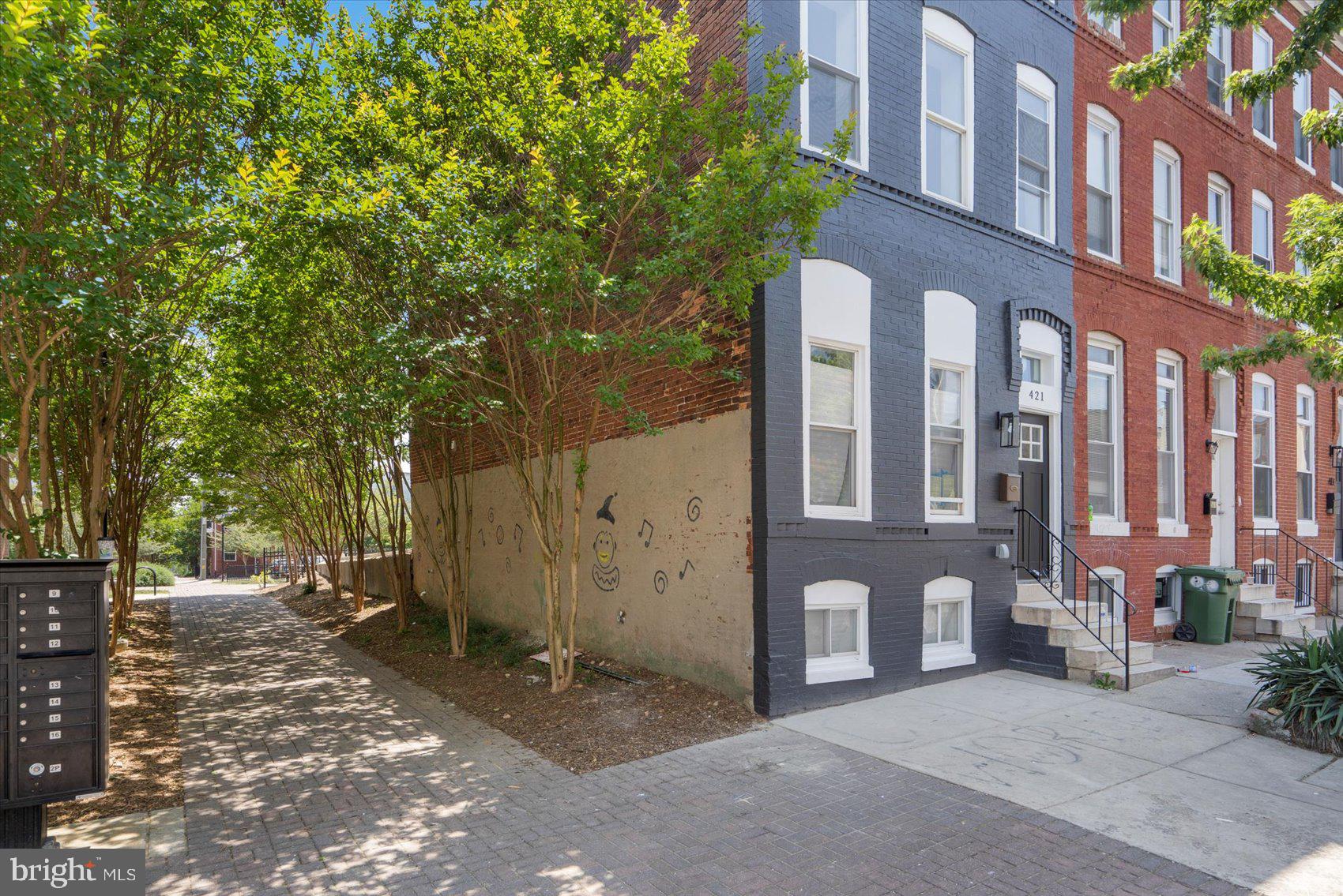 HUGE PRICE DEDUCTION...Experience urban luxury in this stunning end-of-group townhome. Exposed brick walls add character while three levels offer ample space. The main bedroom impresses with a double vanity, jacuzzi tub, and separate shower. Enjoy the gourmet kitchen with granite counters. This 3-bedroom, 3-full-bath, 1-half-bath home is a unique find in a vibrant location.
