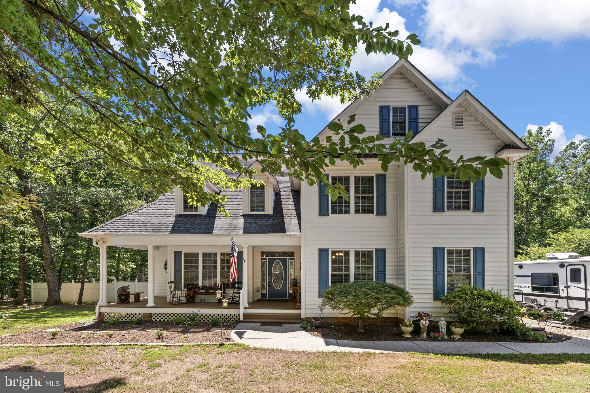 Welcome home to this spacious and beautifully designed 5-bedroom, 2.5-bath residence that offers the perfect blend of comfort, functionality, and outdoor living. Thoughtfully designed with the primary suite on the main level, you'll enjoy a private retreat featuring an adjoining bath complete with a relaxing soaking/jetted tub and a generous walk-in closet.

The main level is ideal for both everyday living and entertaining, offering a welcoming family room with a cozy gas fireplace, a formal dining room for special gatherings, a large kitchen with abundant workspace and a sunny breakfast area, an expansive den, a convenient laundry room, and a half bath.

Upstairs, you'll find four additional bedrooms, including an oversized bedroom with a spacious sitting area—perfect as a guest suite, hobby room, or private retreat—along with three additional bedrooms and a full bath. Need extra storage? The walk-up, floored attic provides exceptional storage space with easy access.

Step outside and discover your own private oasis. The large rear deck overlooks the above-ground pool and expansive backyard, creating the perfect setting for summer entertaining, family gatherings, or simply relaxing. Garden enthusiasts will appreciate the fenced garden area with raised beds, while the play area with a charming treehouse offers endless opportunities for outdoor fun.

Car enthusiasts, hobbyists, and craftsmen will love the detached garage/workshop, complete with a wood stove, making it an ideal space for year-round projects, woodworking, or working on vehicles.

From its spacious interior to its incredible outdoor amenities, this exceptional property truly has something for everyone. Don't miss the opportunity to make this one-of-a-kind retreat your forever home!