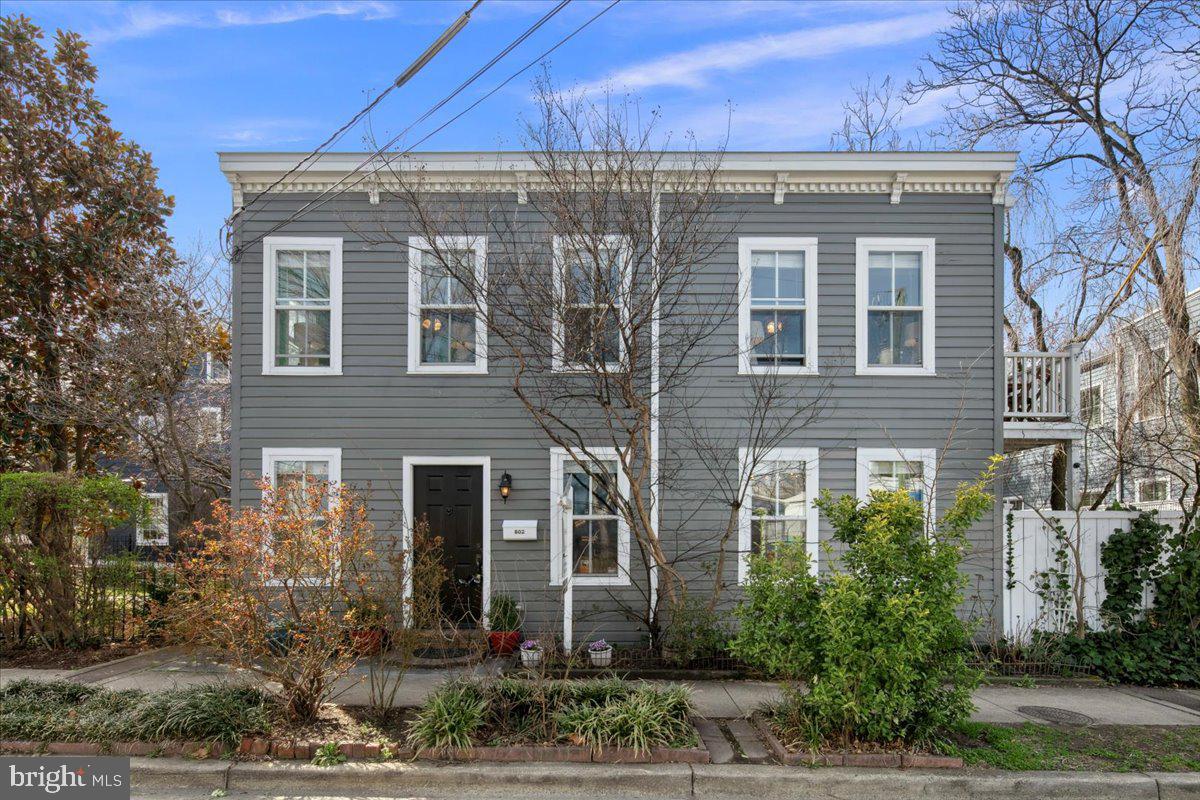 Welcome to 802 Pendleton Street, a charming end-unit row home, nestled in the heart of Old Town Alexandria. This delightful 2-bedroom, 1.5-bathroom home offers 1,152 square feet of thoughtfully designed living space.

Step inside to discover an open-concept main level that maximizes every square foot, providing distinct areas for cooking, dining, and relaxation. Enjoy hardwood floors throughout the home and lots of natural light. The recently renovated kitchen includes granite counters, stainless steel appliances, gas cooking, lots of counter space and an eat-in kitchen space. French doors lead to a private fenced patio with mature trees that is perfect for grilling, entertaining, and relaxing.

Upstairs, you'll find two generously sized bedrooms (one with a balcony) and a beautifully updated full bathroom. The 2022 renovation introduced ample storage solutions, making the space both practical and stylish.

This home's location can't be beat. Enjoy easy access to all the dining and shopping experiences that Old Town Alexandria and King Street have to offer. The Braddock Road metro stop is just a short walk away, providing seamless connectivity to the DC metro area. With accessible street parking and a 5 minute walk to grocery stores such as Harris Teeter and Trader Joe's, this home caters to a lifestyle of convenience and charm. Grab a coffee or quick bite at the deli across the street! Don't miss your chance to own a piece of historic Alexandria living.