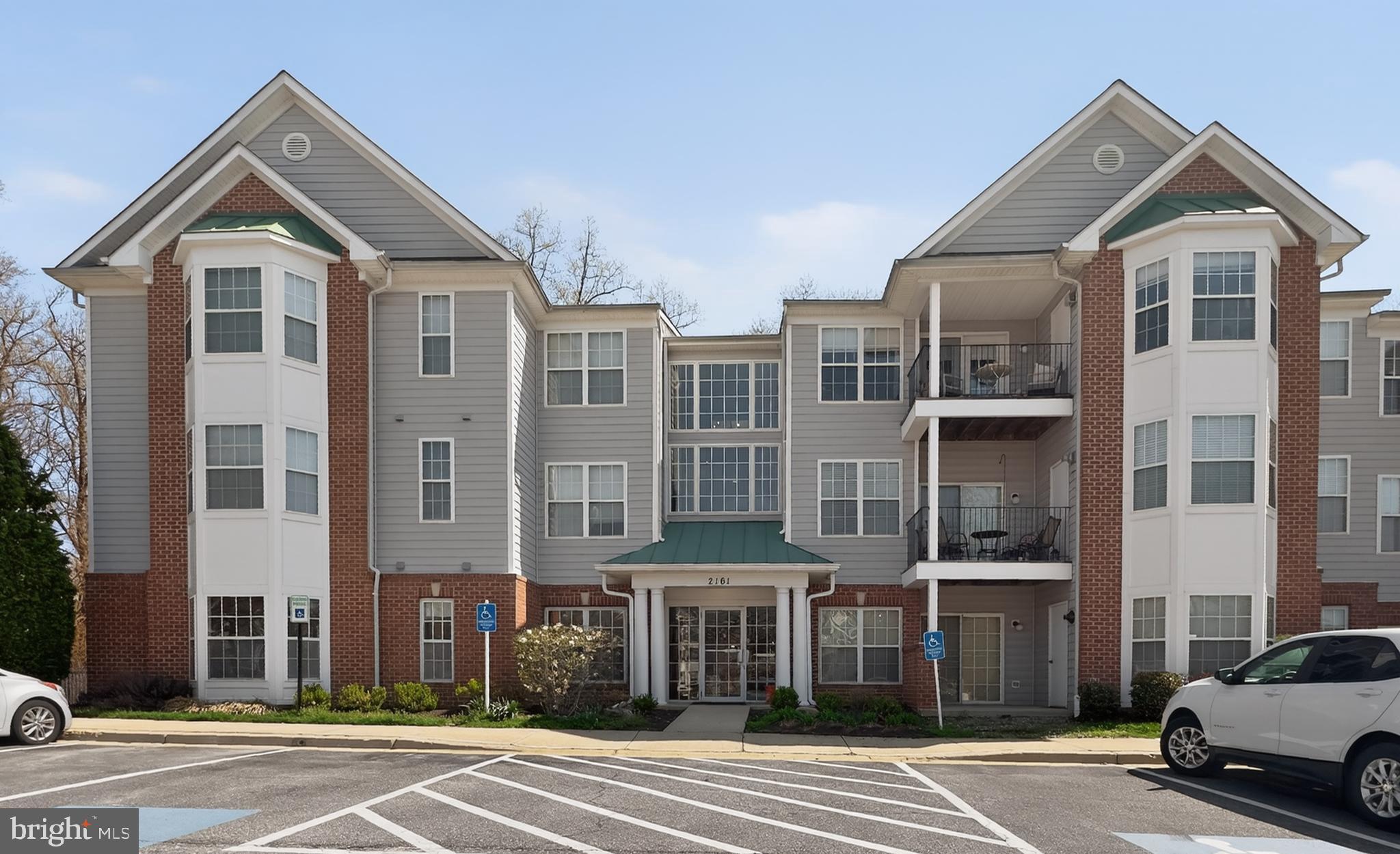 Step into this beautifully maintained top-floor 3-bedroom, 2-bath condo in the desirable Scott’s Crossing Condominiums, offering over 1,320 square feet and a prime location just minutes from the vibrant charm of downtown Annapolis. As you enter, you're welcomed by fresh paint throughout (2026), a foyer with a convenient coat closet, and elegant column accents that open into a bright and airy main living space. The kitchen features warm wood cabinetry, granite countertops, a tiled backsplash, and stainless steel appliances, along with a cozy breakfast nook framed by a bay window overlooking peaceful wooded views. Entertain with ease or unwind at the end of the day in the well-appointed living and dining areas, complete with hardwood floors, 9+ ft ceilings, a cozy gas fireplace, and access to a private patio that offers a serene setting to relax and take in the views. The primary suite is a true retreat, showcasing a vaulted ceiling with a lighted fan and a charming bay window, perfect for a reading nook or sitting area with a tranquil backdrop. Two spacious closets and an ensuite bath with a dual sink vanity and tub/shower combo complete the space. Two secondary bedrooms, each with ample closet space, are thoughtfully positioned for added privacy and versatility, whether used as guest rooms or an in-home office, and share a full bath with a large walk-in shower. A dedicated laundry room with additional storage and a full-sized washer and dryer adds everyday convenience. Recent updates include a newer HVAC (2021), water heater (2022), and plush new carpet (2026). Parking is a breeze in the off-street parking lot. Beyond the community, enjoy the nearby Bestgate Park, Trader Joe’s and Annapolis Mall, plus easy access to major highways for a quick commute to Baltimore, DC, and more. Don’t miss this rare find!