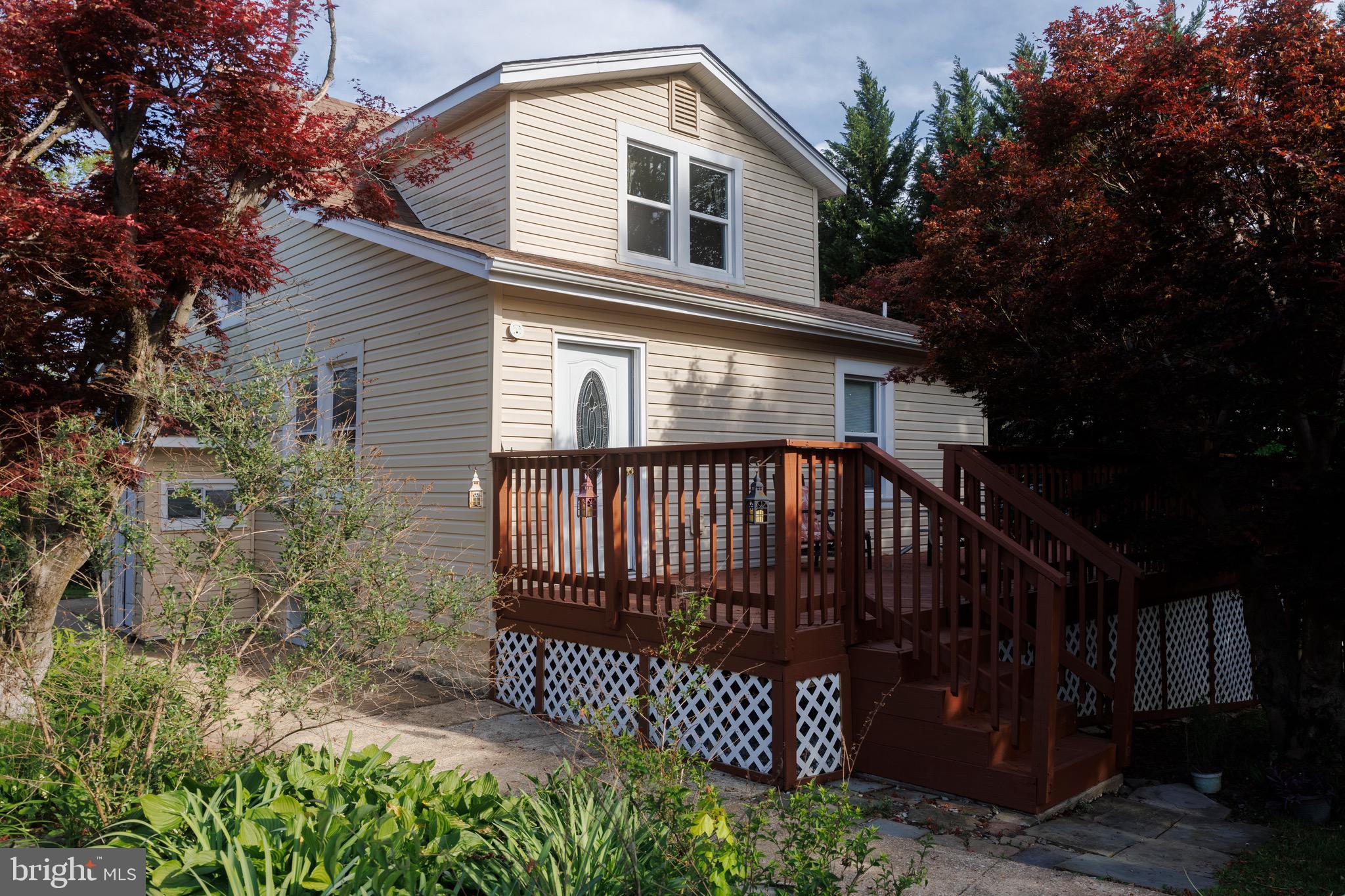 Charming and beautifully remodeled Cape Cod-style home blending timeless character with modern updates throughout! This unique property offers incredible flexibility with a main house plus separate office/in-law suite space — ideal for multi-generational living, a home-based business, rental income potential, or an opportunity to help offset monthly mortgage costs with additional living space. Featuring 3 bedrooms and 3.5 baths, the home showcases warm architectural details, spacious living areas, and thoughtfully renovated interiors designed for comfortable everyday living.

The inviting wraparound porch creates the perfect setting for relaxing or entertaining, while the impressive and spacious two-story detached 2-car garage offers endless possibilities — perfect for car enthusiasts, extra storage, workshop space, creative studio space, hobby use, or additional flexible workspace. The property also features an incredible amount of creative and functional space throughout, allowing buyers to truly make the home their own. A huge flat grassy side yard provides the perfect setting for outdoor entertaining, play, gardening, or simply enjoying the peaceful surroundings.

Tucked away on a quiet cul-de-sac yet close to everything, this home offers unbeatable convenience with quick access to Rt. 29, Rt. 40, I-70, Baltimore, and Washington, D.C. Located just minutes from Historic Downtown Ellicott City, Patapsco Valley State Park, excellent schools, and countless shopping and dining options, the location perfectly balances charm, nature, and accessibility.

Being sold as-is and is a rare turnkey opportunity ideal for homeowners, investors or buyers seeking a unique property filled with flexibility, character, charm, income potential, and convenience. Schedule your showing today!