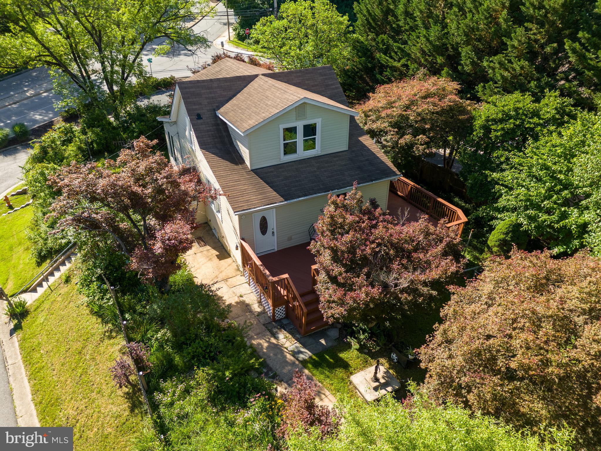 Charming and beautifully remodeled Cape Cod-style home blending timeless character with modern updates throughout! This unique property offers incredible flexibility with a main house plus separate office/in-law suite space — ideal for multi-generational living, a home-based business, rental income potential, or an opportunity to help offset monthly mortgage costs with additional living space. Featuring 3 bedrooms and 3.5 baths, the home showcases warm architectural details, spacious living areas, and thoughtfully renovated interiors designed for comfortable everyday living.

The inviting wraparound porch creates the perfect setting for relaxing or entertaining, while the impressive and spacious two-story detached 2-car garage offers endless possibilities — perfect for car enthusiasts, extra storage, workshop space, creative studio space, hobby use, or additional flexible workspace. The property also features an incredible amount of creative and functional space throughout, allowing buyers to truly make the home their own. A huge flat grassy side yard provides the perfect setting for outdoor entertaining, play, gardening, or simply enjoying the peaceful surroundings.

Tucked away on a quiet cul-de-sac yet close to everything, this home offers unbeatable convenience with quick access to Rt. 29, Rt. 40, I-70, Baltimore, and Washington, D.C. Located just minutes from Historic Downtown Ellicott City, Patapsco Valley State Park, excellent schools, and countless shopping and dining options, the location perfectly balances charm, nature, and accessibility.

Being sold as-is and is a rare turnkey opportunity ideal for homeowners, investors or buyers seeking a unique property filled with flexibility, character, charm, income potential, and convenience. Schedule your showing today!