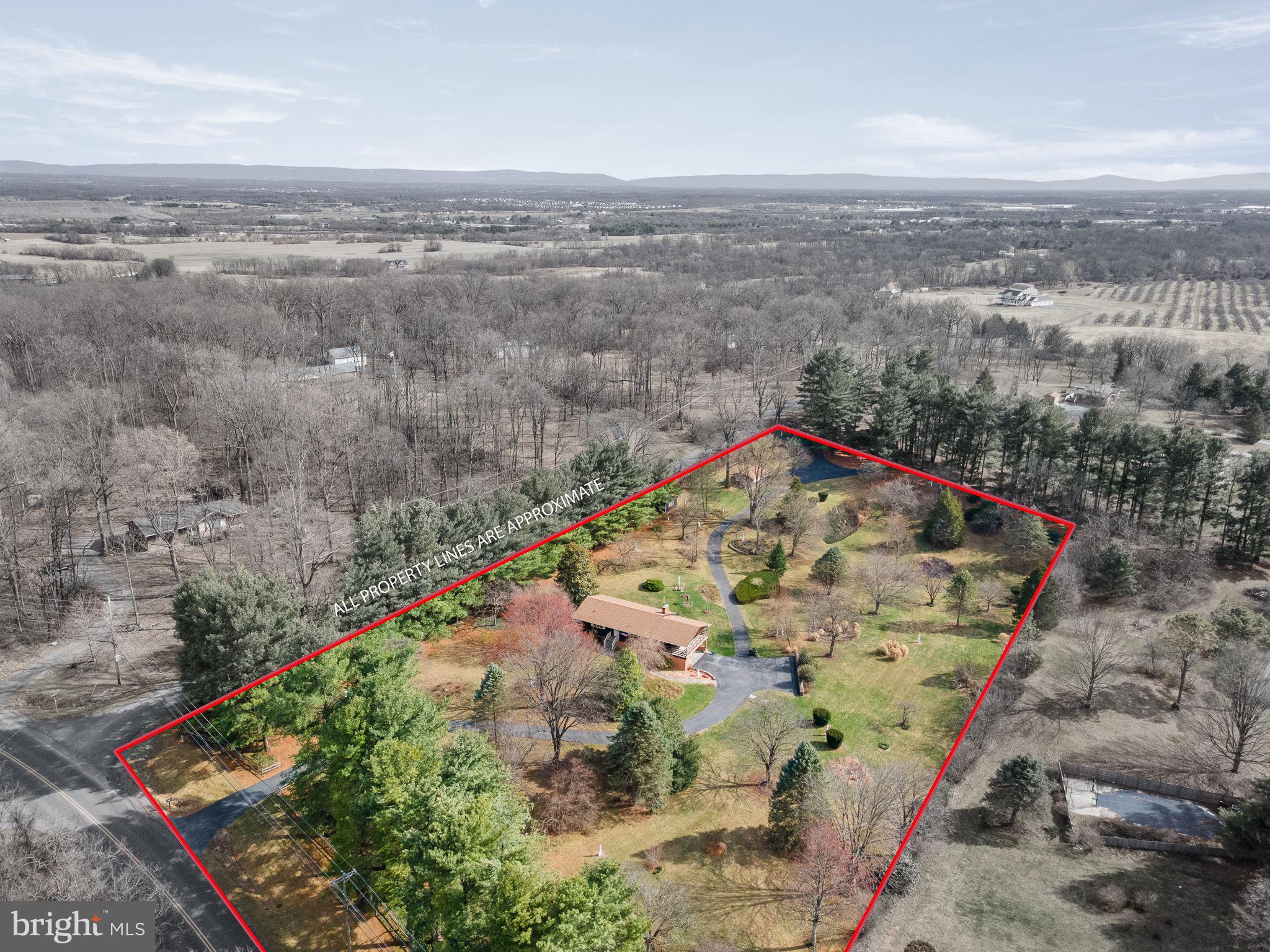 Set on **2 combined lots totaling 4.34 acres**, this exceptional property offers space, flexibility, and incredible potential. The primary lot spans **2.25 acres** and features a **5-bedroom, 2-bath home** with a **NEW ROOF** surrounded by **professionally designed and impeccably maintained landscaping**, creating a true private **oasis of beauty and nature**.   The home offers a functional layout with a **breakfast room just off the kitchen**, along with **living and dining rooms featuring large windows that capture stunning views of the surrounding landscape**.  Step outside to the **large covered deck off the kitchen**, the perfect place to relax, entertain, and enjoy peaceful outdoor living. The **lower-level family room** provides additional living space and flexibility.   The second parcel includes **2.09 acres of cleared land with the ability to build**, opening the door to endless possibilities—**build a guest house, construct a second home to rent or sell, sell the lot separately, or create the ultimate outdoor retreat**.   Parking is plentiful with a **detached garage, 2-car carport, and extensive driveway space**.  A **storage shed** adds additional convenience.   All of this is located in a **peaceful rural setting with easy access to Route 81**, offering both privacy and convenience.   **A rare opportunity to own a beautifully maintained property with acreage, views, and future potential.**
