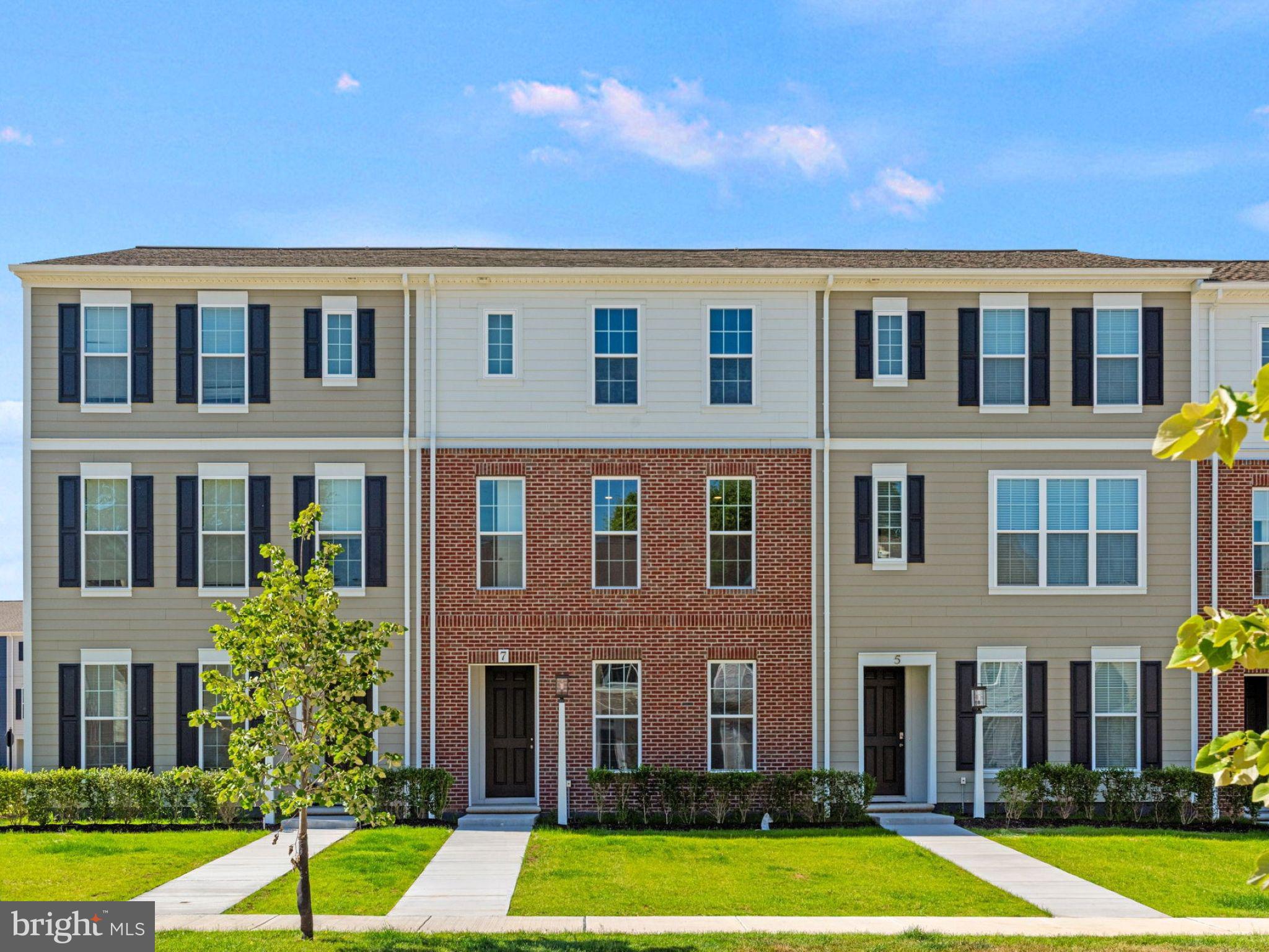 Perched along the neighborhood green and ready by winter, this move-in ready luxury townhome blends timeless charm with modern elegance. Step inside to 9' ceilings and rich luxury vinyl plank flooring throughout the main level. Natural light fills the open-concept great room, dining area, and chef-inspired kitchen—perfect for gatherings or quiet evenings. The front study offers a private retreat, while the kitchen impresses with an oversized eat-in island, prep island, stainless steel appliances, quartz countertops, designer tile backsplash, and stylish rye-stained cabinetry. Upstairs, unwind in the serene primary suite with a spa-like bath and walk-in closet. Two additional bedrooms and a full bath provide comfortable space for family or guests. The finished lower-level game room is perfect for movie nights, workouts, or weekend fun. Outside, a classic partial brick façade and landscaped entry create strong curb appeal, while expansive green space just outside the front door invites outdoor living. Located in the Cumberland Valley School District, Grange blends small-town charm with luxury finishes. Grange features preserved green spaces, a wildflower meadow, mature trees, walking trails, and gathering areas. This home is eligible for special incentives—contact us for details.