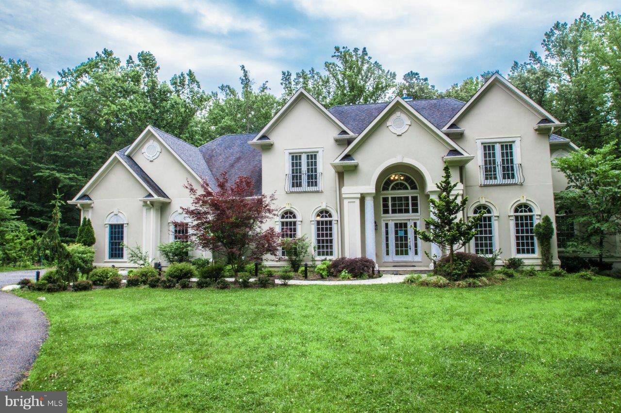 Secluded waterfront retreat on 22 acre private reserve. This well designed home encompasses 10,000+ sq ft of very functional space & features a grand staircase entrance. Main level Master suite w/FP, chef's kitchen adjoins family room, top of the line appliances, cherry cabinets and granite. Lower lvl home theatre, wine room, sauna and leads out to pool, hot tub & lit trail to pier w/lift & elec.