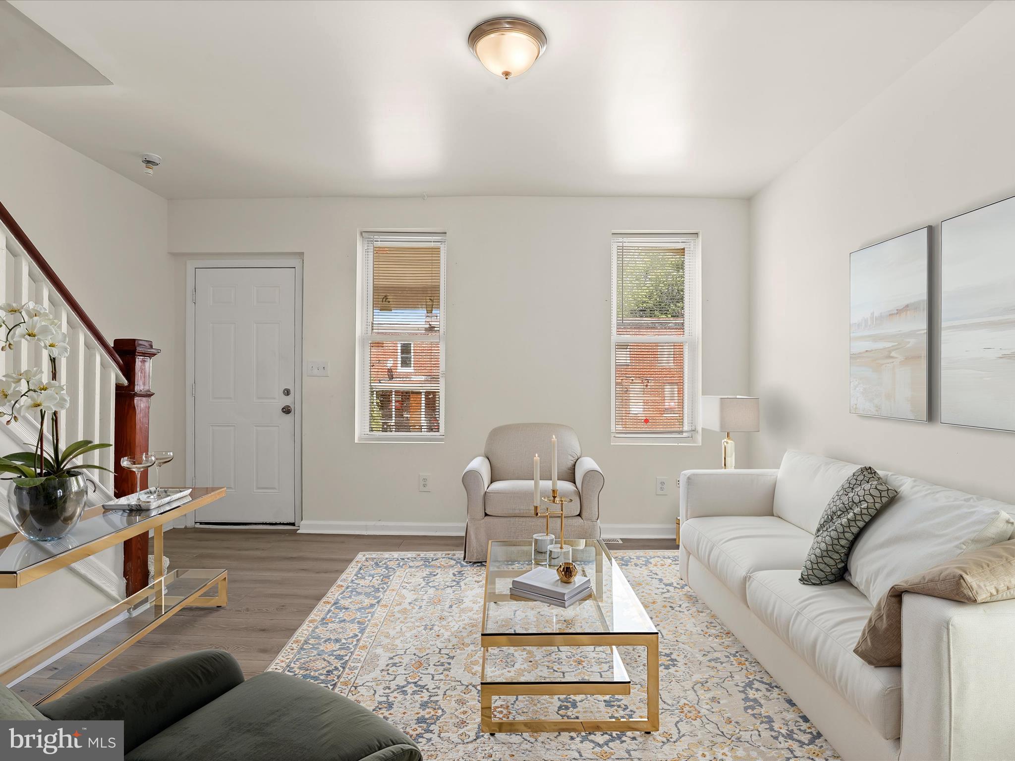 IMMEDIATE AVAILABILITY >> Home Qualifies for 100% Financing & Up To $10,000 in Closing Cost Help << >> NO HOA << Gorgeous Gleaming Hardwood Floors, Fresh Paint and Sunlit Living Spaces That Feel Instantly Inviting. Upstairs Offers Three Spacious Bedrooms, New Carpet & A Stylishly Updated Full Bath. The Partially Finished Basement Adds Flex Space For A Rec Room, Office, Or Storage—Plus Laundry And Walk-Out Access to a Private Fenced Yard Built Cookouts with Family & Friends. Updated Systems, And On-Street Parking Round Out The Package. Minutes From Herring Run Park, Local Shops, Schools and Easy Access to  Major Commuter Routes (Walking Distance to MTA)—This Location Delivers Convenience Without Compromise.