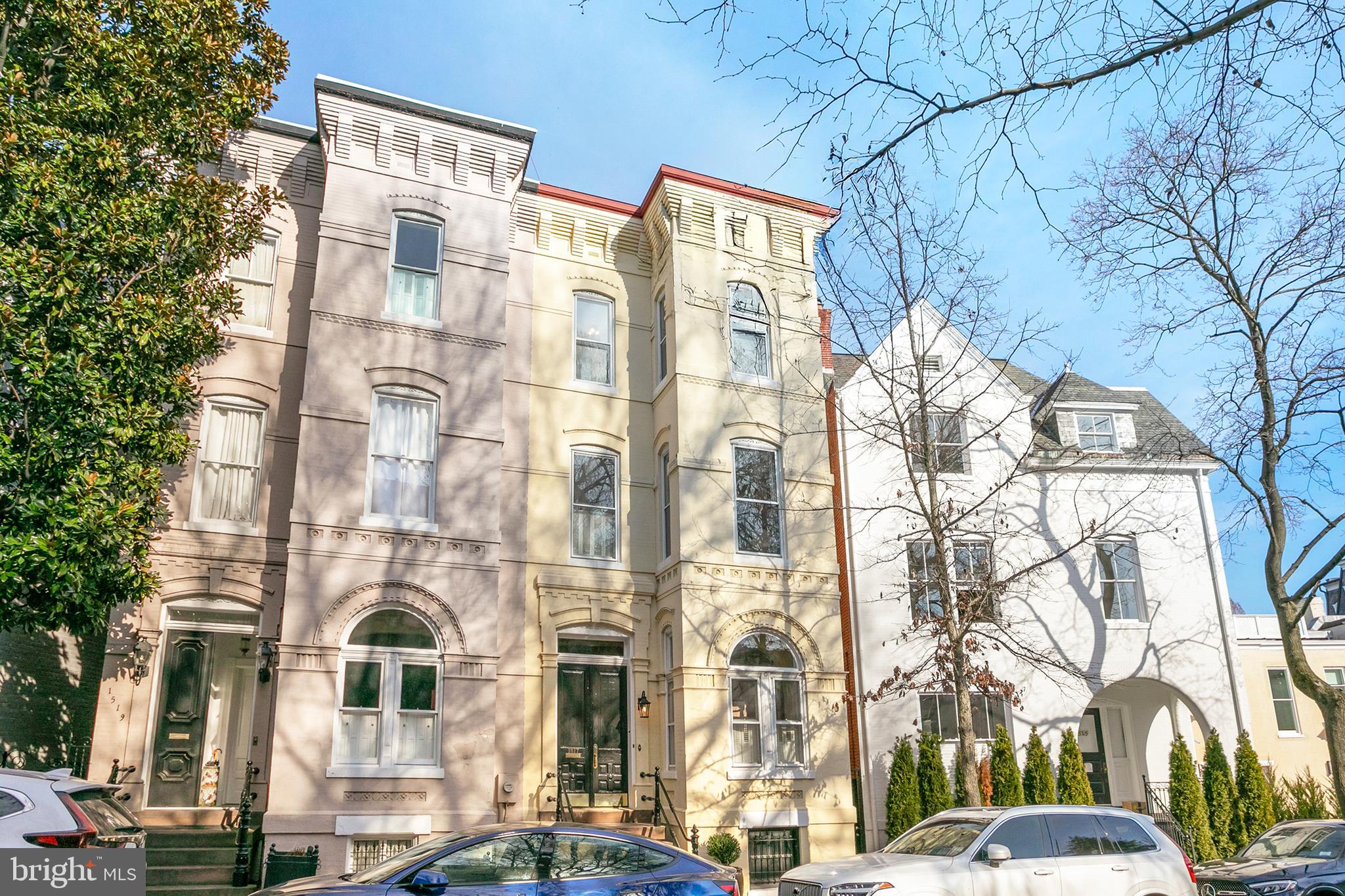 This historic gem, dating back to before 1900, presents a Federal-style brick facade exuding timeless elegance. Across its four floors and over 4100 square feet, it boasts five bedrooms and 4.5 baths, offering ample space for both casual relaxation and formal entertainment. Upon entering the house, you're greeted by a first level adorned with beautiful elegant detail work. Intricate moldings frame the ceilings, while pocket doors subtly divide the spaces, allowing for seamless flow. Original millwork adds depth and character to every corner, showcasing the craftsmanship of a bygone era. Ornate fireplaces in both the living room and dining room serve as focal points, each with its own unique charm and history, inviting cozy moments on chilly evenings. These exquisite touches further enrich the Federal-style ambiance, preserving the timeless elegance that defines the home's character. Adding to the sense of grandeur are the 10-foot + ceilings, while the lower porch off the kitchen and dining area provides a cozy retreat for al fresco dining, and the upper porch off the owner's suite offers a tranquil space for morning coffee or evening unwinding. The front grand stair and beautiful rear staircase allow access to all floors, ensuring seamless movement throughout the house. Additionally, the lower level contains a family room with a walkout to the rear garden, along with an in-law suite, providing added versatility and functionality to the home's layout. Moreover, the property boasts plenty of outdoor space, including an oversized rear garden, perfect for enjoying the outdoors in privacy and serenity. Situated in the heart of the coveted East Village of Georgetown, a block from the Tudor Place Mansion and Gardens, the location offers unparalleled convenience. Nature enthusiasts will appreciate its proximity to Montrose Park and Dumbarton Oaks.