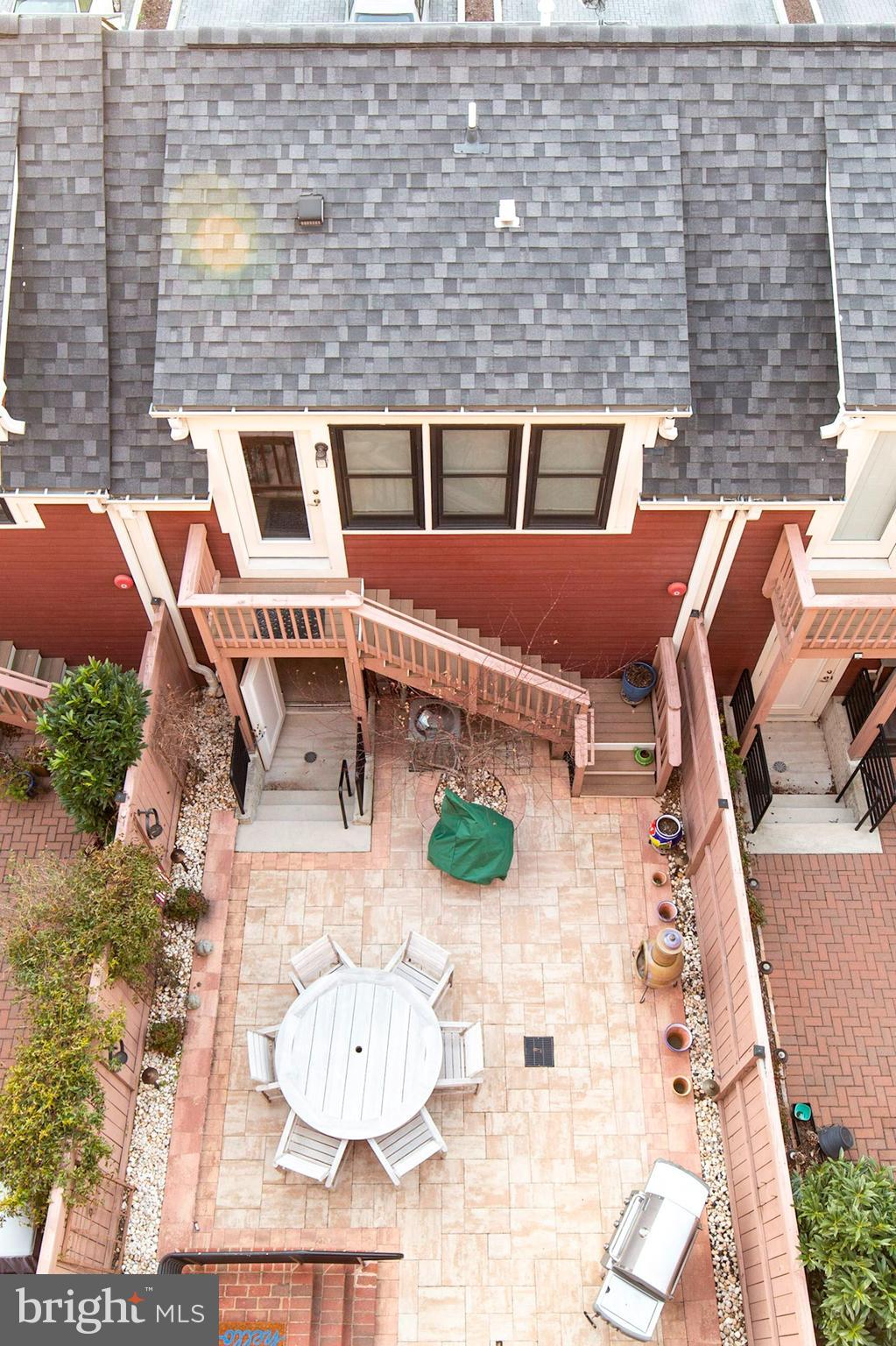 The most luxurious 4 level townhome w/in-law suite located above detached 2-car  gar! Boasting nearly 4,000 sq ft of sheer elegance inside and out! Every inch of this home was thoughtfully designed by professional interior designers and landscape architects. From the custom millwork mural installations on the main level, Restoration Hardware light fixtures,  to the plantation shutters & HW floors throughout , you won't have to lift a finger to update a thing! Gourmet kitchen clad w/ Quartz counters, under cabinet lighting, ample storage, high end SS appliances, as well custom shelving organizers in every closet, even in the pantry and laundry room! The kitchen exits to your extensive hardscaped rear patio where you will find hosting large groups a breeze! The freshly painted rear fenced yard offers exterior gas line for direct grill connect, w/gorgeous pavers all leading to your 2-car detached smart garage. Garage offers ample storage & upgraded wiFi enabled motor to easily welcome your Amazon deliveries day/night! Offer guests/in-laws their very own private living space above which is fully equipped w/full bathroom,  kitchenette, ample cabinet storage, mini-fridge, and HW floors!  Back inside, you will find that the  primary bedroom welcomes your California King bed w/plenty of room to spare for end tables and oversized furniture, not to mention his/her wardrobes w/custom closet organizers (even jewelry organizers)! Your hall of closets pave the way to the spa-like en-suite. Primary bath includes timeless marble finishes, frameless elongated shower w/bench seating, dual vanities, and linen closet.  Adjacent to the primary bedroom you'll find what could easily serve as a nursery/5th bedroom  w/closet (while not currently a legal bedroom but quite often used as such ), or great for a home office w/built-in bookshelves already in place! Laundry room is conveniently located in the hall of the 3rd floor,  nestled between 2 more bedrooms, full bath, and family room. Family room is equipped w/wet bar,  beverage cooler, and an abundance of windows making this a great space for a sun filled in-home gym/office and/or doubles as a fantastic entertainment area to watch your favorite sports games! Heading up to the 4th floor you have  a rec room uniquely appointed with distressed shiplap accent walls, and a commissioned masterpiece rolling train door (actual train door- barn doors are so 2020...), homage to the Potomac Train Yard, another wet bar and beverage cooler, not to mention a double-sided gas fireplace that you can enjoy inside & outside from the oversized rooftop terrace! You'll love the prime location too!! Walk across the street a few block to all the shops/dining in Del Ray, quick Uber ride to Old Town Alexandria, DC, or Regan Airport (all just 7-15 mins from your front door!). With Amazon on the way, the National Landing build out in Crystal City in progress, Potomac Yard Metro near completion, and the vast acreage that the new Virginia Tech campus is building up nearby, this home will easily be the greatest investment decision you will make in your lifetime! Do not forget to check out the property video attached! WELCOME HOME- YOU HAVE ARRIVED!!