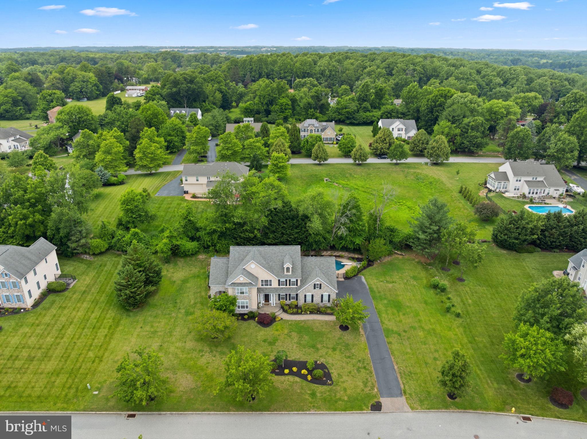 Properties in this Garnet Valley neighborhood are rarely available and almost never at this price, which is well below recently appraised value! Move-in ready, no HOA, Award-winning Garnet Valley Schools, an in-ground pool, and more storage than you could ever need! Finished basement with brand new carpet, designated gym space, screening room, and half bath means whoever is down there likely won't come up for a long time! Main floor showcases beautiful hardwoods, laundry room with exit to pool. Drop-zone from 3-car garage with built-in cubbies so everyone can put away their belongings before entering to the large gourmet kitchen. In addition to a traditional formal living room and dining room on either side of the grand two-story foyer, the first floor features a flex room with exterior exit to private porch could be used as an office, bedroom, playroom, or a sunny sitting room to enjoy your morning coffee. And tying it all together is the heart of the home--a spacious great room where family and friends can gather after holiday dinners or to relax after some pool time. Designed for effortless indoor-outdoor living, the great room's new luxury vinyl plank flooring stands up beautifully to wet feet, pets, and everyday wear, making this home ideal for indoor-outdoor living. The upstairs features the primary bedroom with tray ceiling, two walk-in closets, an enormous bath with jacuzzi tub and separate tiled shower. Attached to the primary suite is an adjacent room that could be an office, convenient nursery, TV/sitting room, or even a dressing room large enough to fit any custom closet design the owner could dream of. Completing the upstairs is a secondary suite with its own private full bath, and three more bedrooms larger than you'll see in almost any new construction. A hall bath with double sinks is shared by the three spare bedrooms. The upstairs has its own heating and cooling zone with newer condenser. New carpet in the primary bedroom, one spare bedroom, and hallway. New LVP in the additional room off the primary. Property extends beyond side of pool fence to between neighboring home. Move right in and host a housewarming party with your new pool in a neighborhood you'll never want to leave! ***Borrowers who obtain financing through the Colucci Lending Team may be eligible for a temporary 1/0 interest rate buydown on a conforming loan with a principal balance up to the applicable conforming loan limit of $832,750, subject to lender approval, underwriting requirements, program guidelines, and other applicable terms and conditions***
