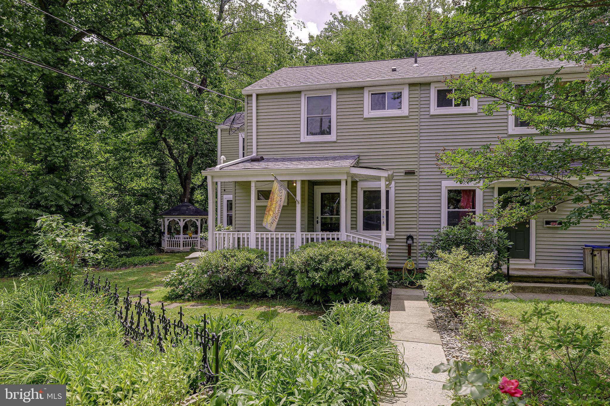 This charming end-unit townhome with a one-of-a-kind, two-story addition offers extra living space, plus a convenient main-level half bath with laundry. Inside, it feels almost like you're in a treehouse! You'll find original hardwood floors, fresh paint, and plenty of natural light. Outside, enjoy a spacious private yard with a gazebo, new shed, and a peaceful setting backing to woods and Greenbelt’s Firefly Sanctuary. Unlike many woodland-backed homes located on the community’s outer edges, this home is just a short walk from Greenbelt’s historic town center, shops, restaurants, parks, library, and community events! This centralized, yet sheltered example of the Greenbelt Co-op community beautifully combines the privacy of a natural setting with the convenience, walkability, and friendliness that make Greenbelt such a special place to call home! 
This is a co-op, see http://ghi.coop for information about the community. Co-op fee is estimated. Cash or conventional financing only, with GHI approved lenders. Co-op fee includes PROPERTY TAXES, insurance, and major exterior and interior maintenance.